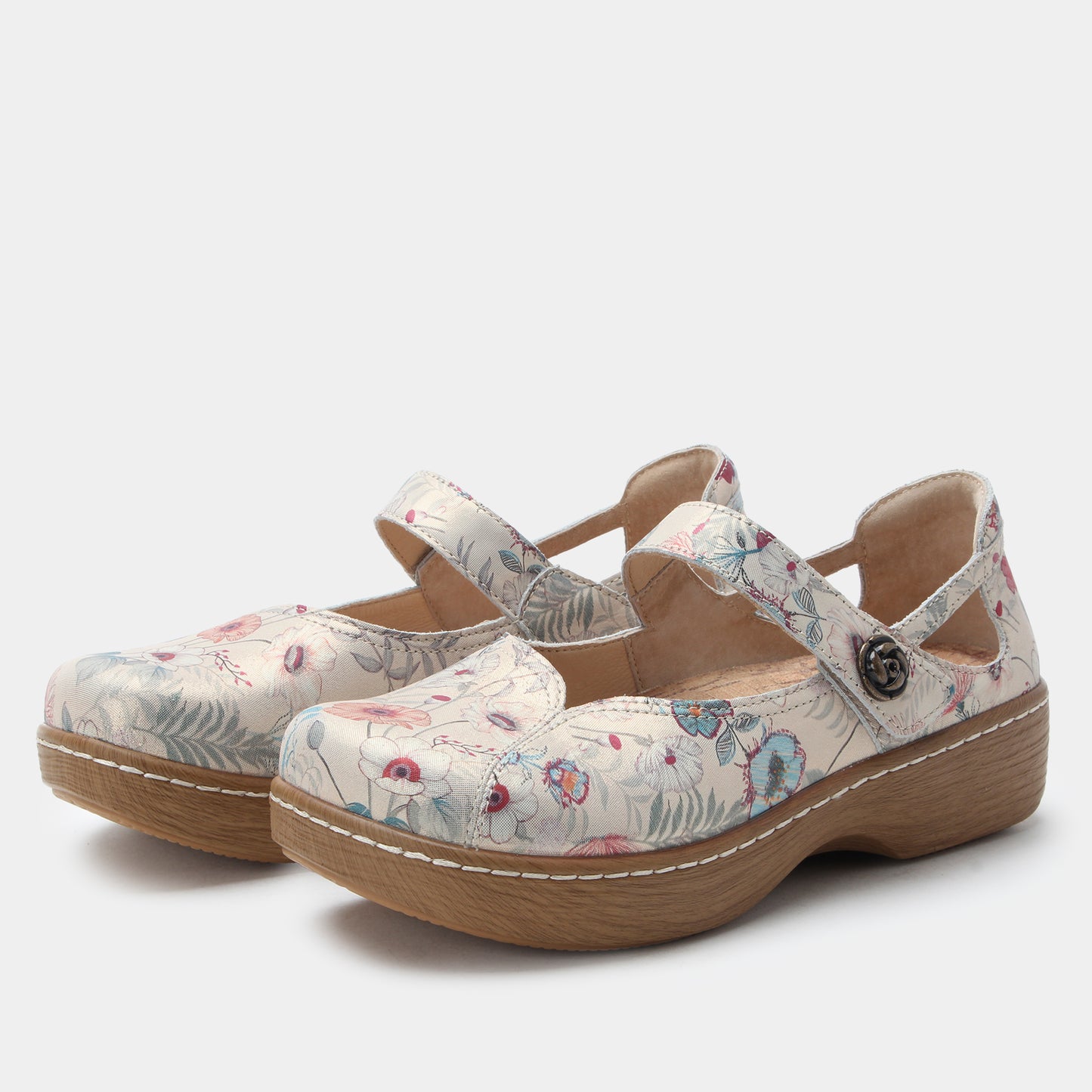 Pair of floral-patterned clogs on a white background