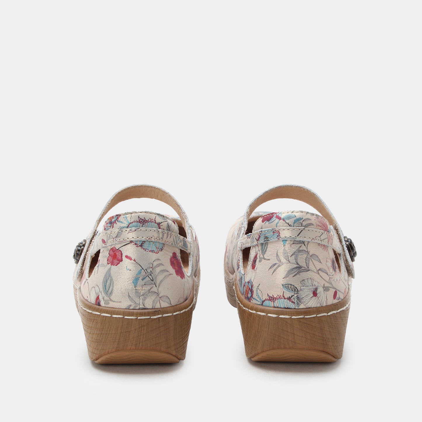 Pair of floral wedge sandals on a white background