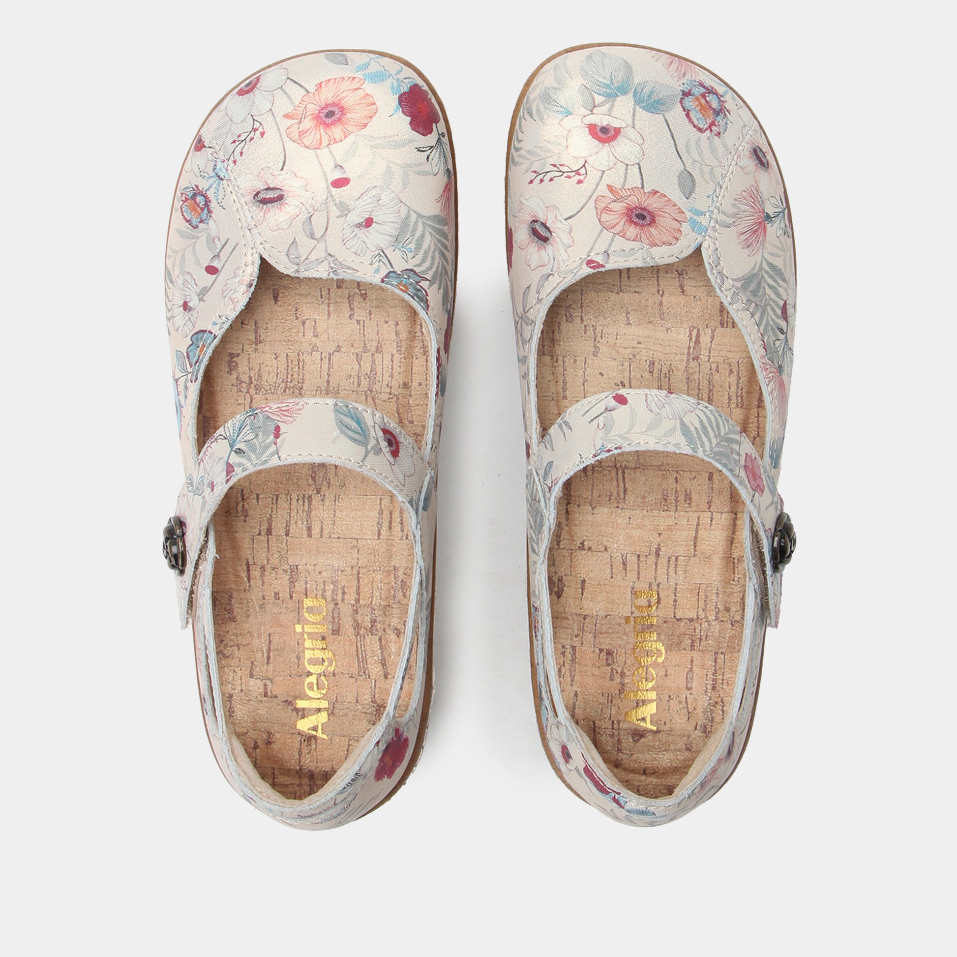 Pair of floral-patterned clogs on a white background