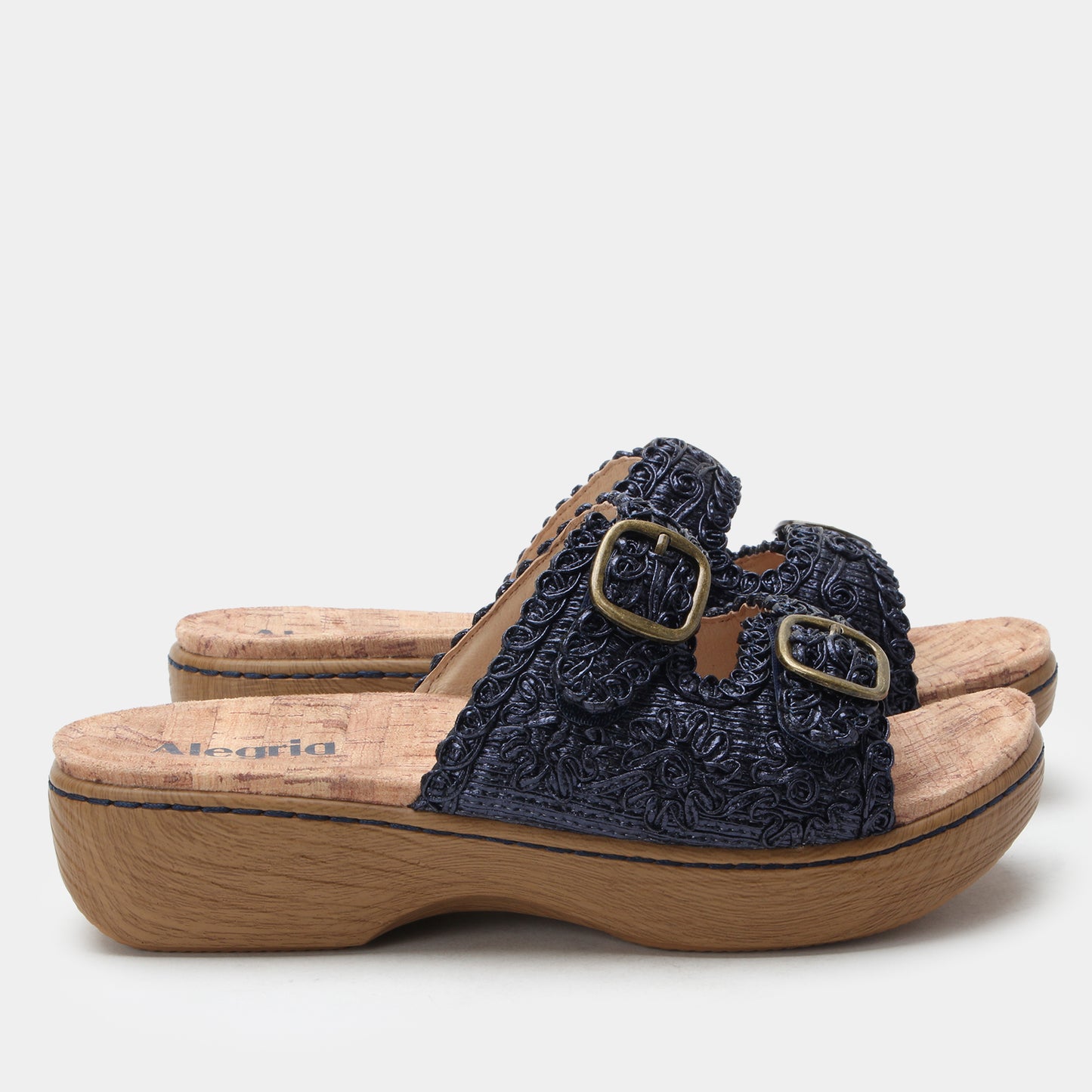 Navy embroidered sandal with wooden sole on a white background