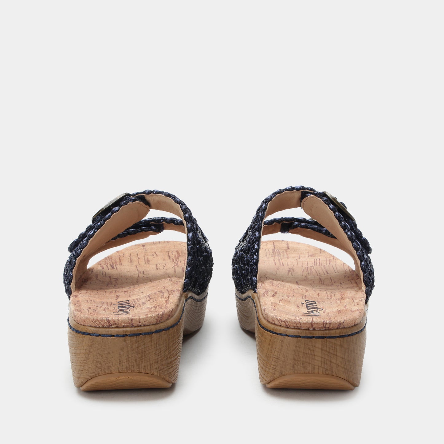 Pair of sandals with cork sole on a light gray background