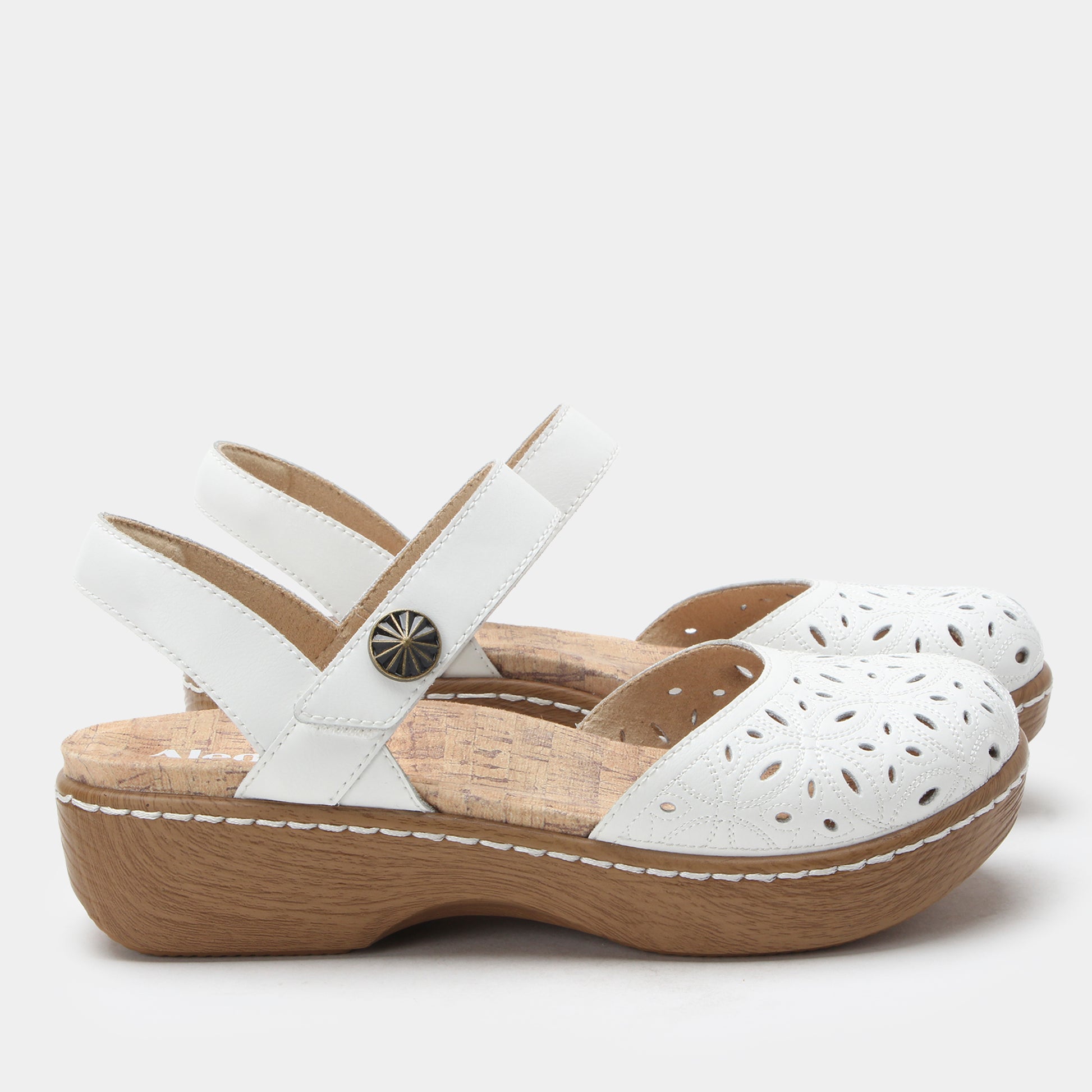 White sandals with wooden soles on a light gray background