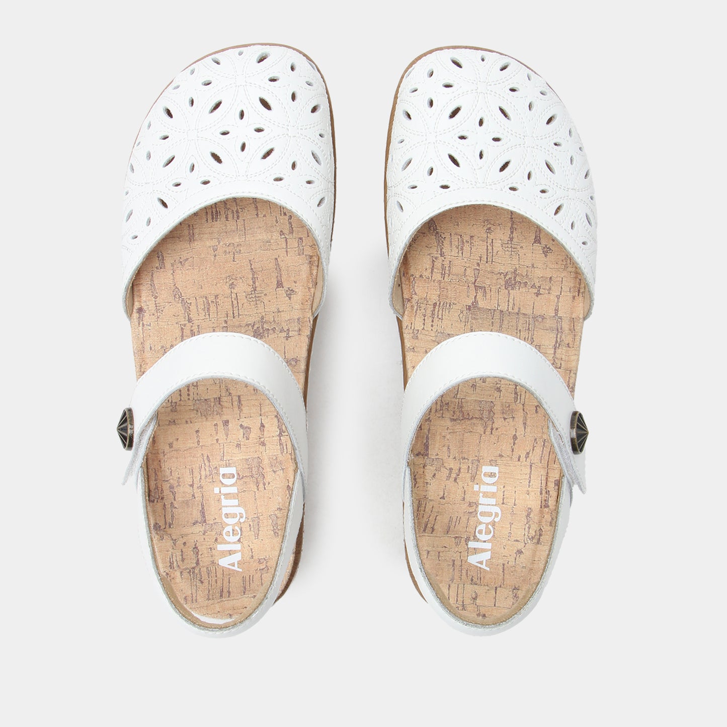 White sandals with cork insoles on a white background