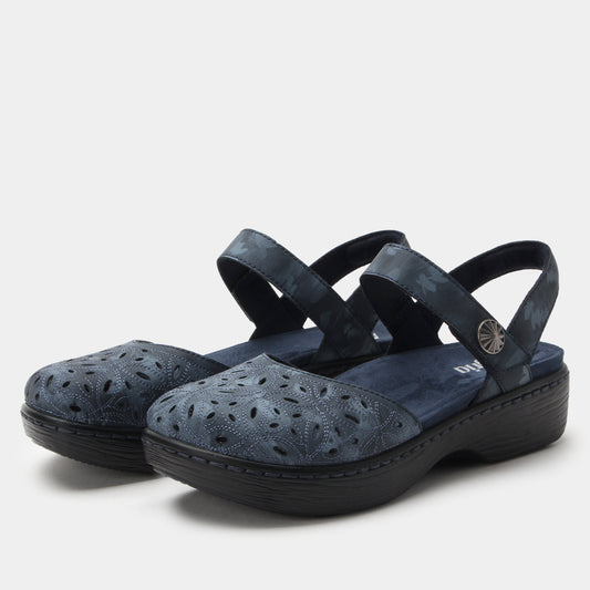 Pair of blue sandals with black straps on a light gray background