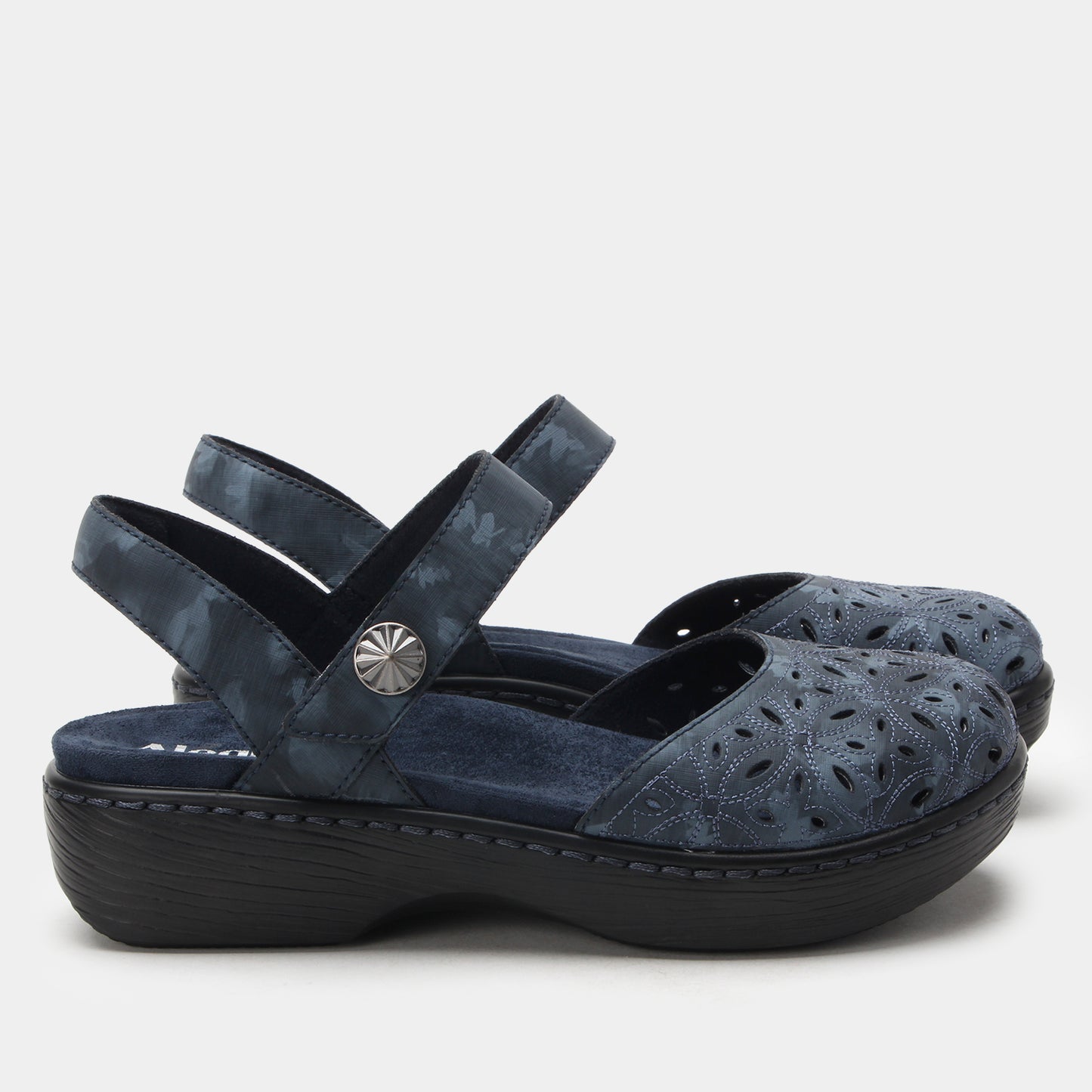Navy blue sandal with a platform sole on a light gray background