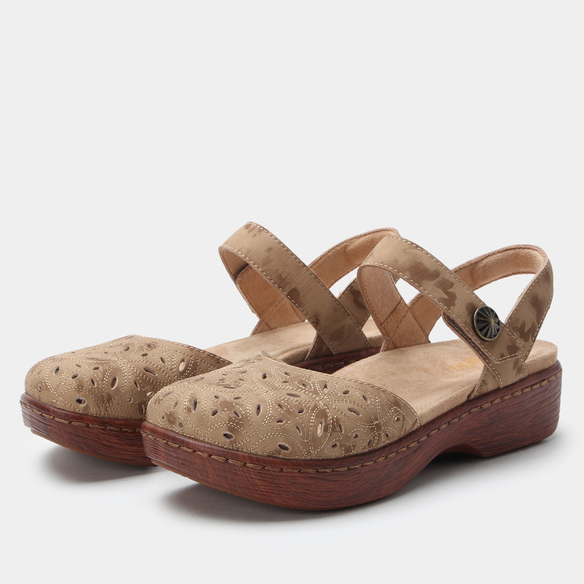 Pair of beige sandals with wooden soles on a light gray background