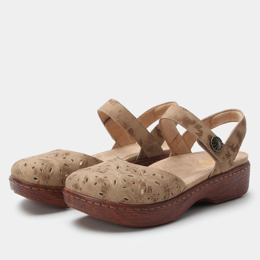 Pair of beige sandals with wooden soles on a light gray background