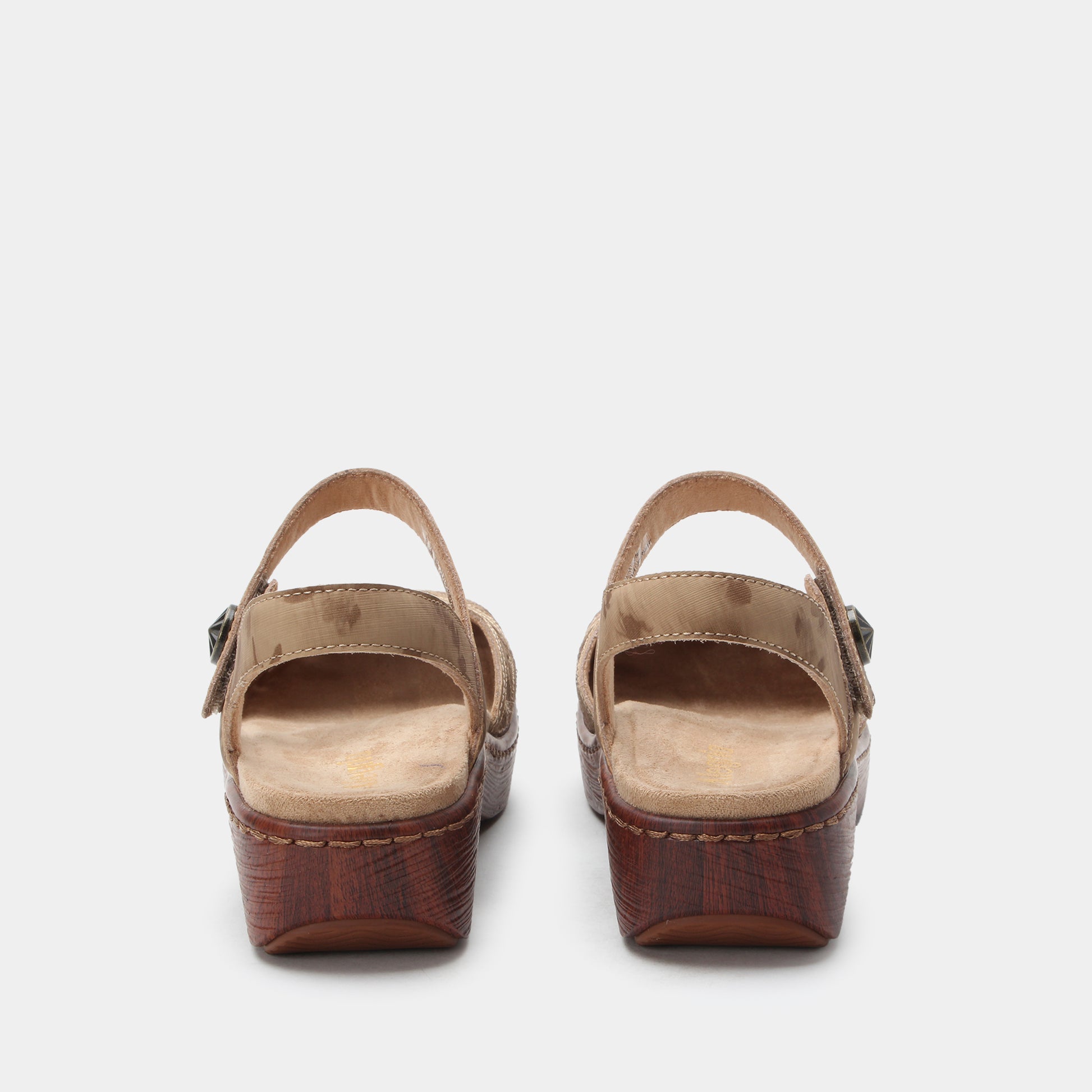 Pair of brown sandals on a white background