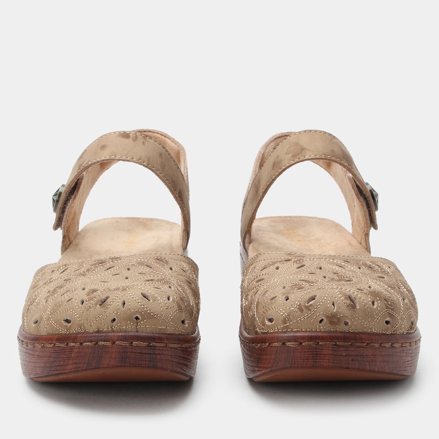 Pair of beige sandals with wooden soles on a white background