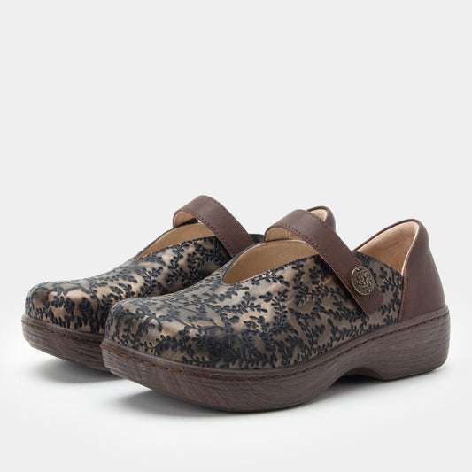 Pair of floral-patterned clogs with brown straps on a white background