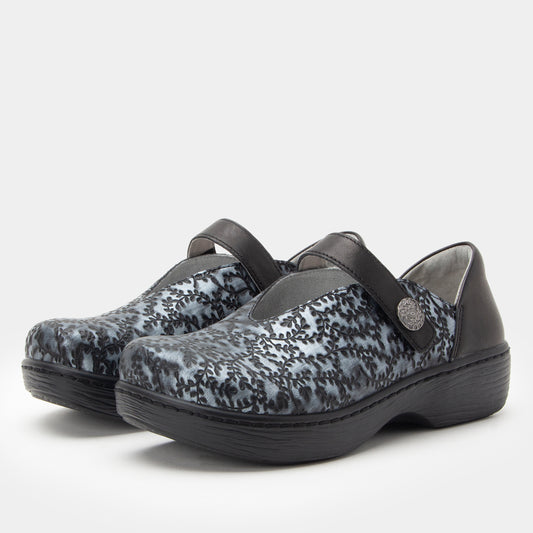 Pair of black and gray patterned shoes with a strap on a white background