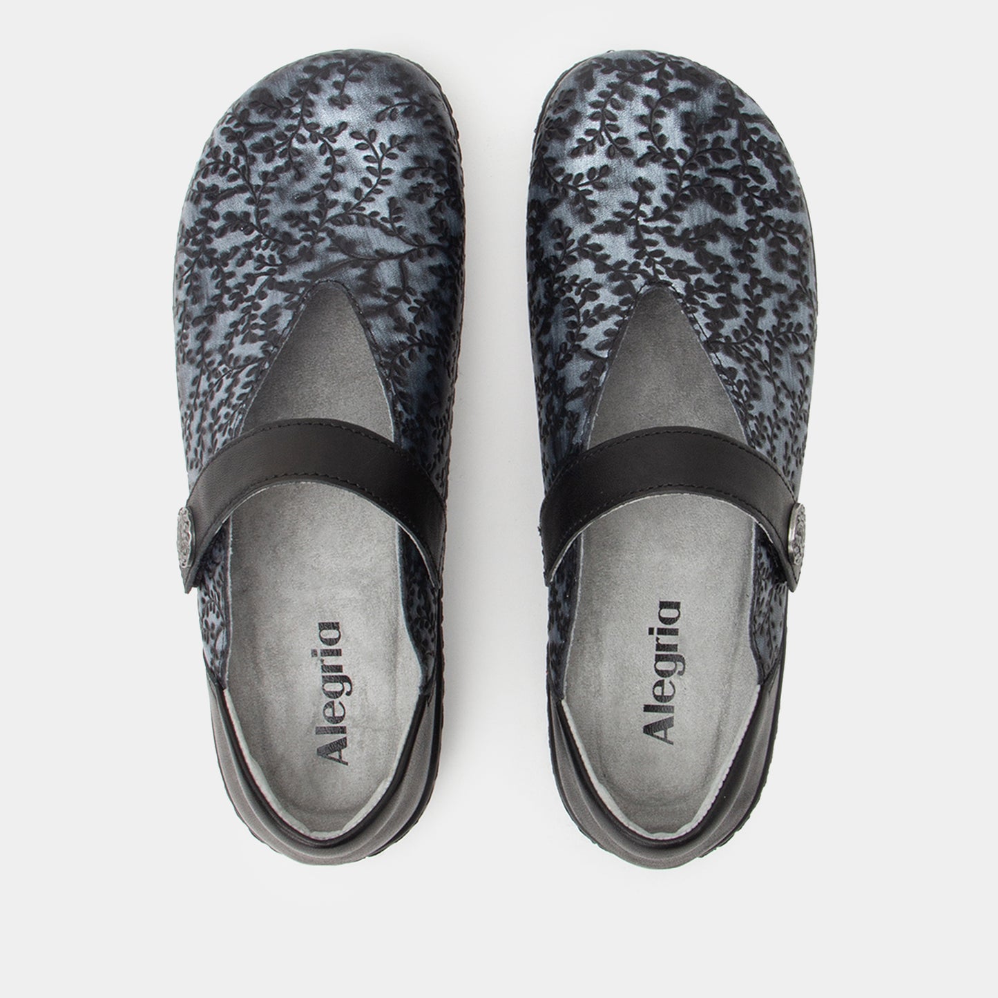 Pair of Alegria shoes with floral pattern on a white background