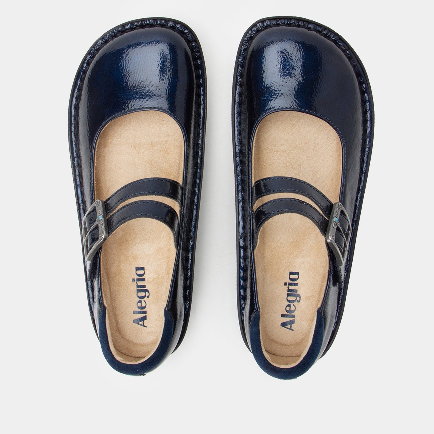 Pair of navy blue shoes with 'Alegria' branding on a light gray background