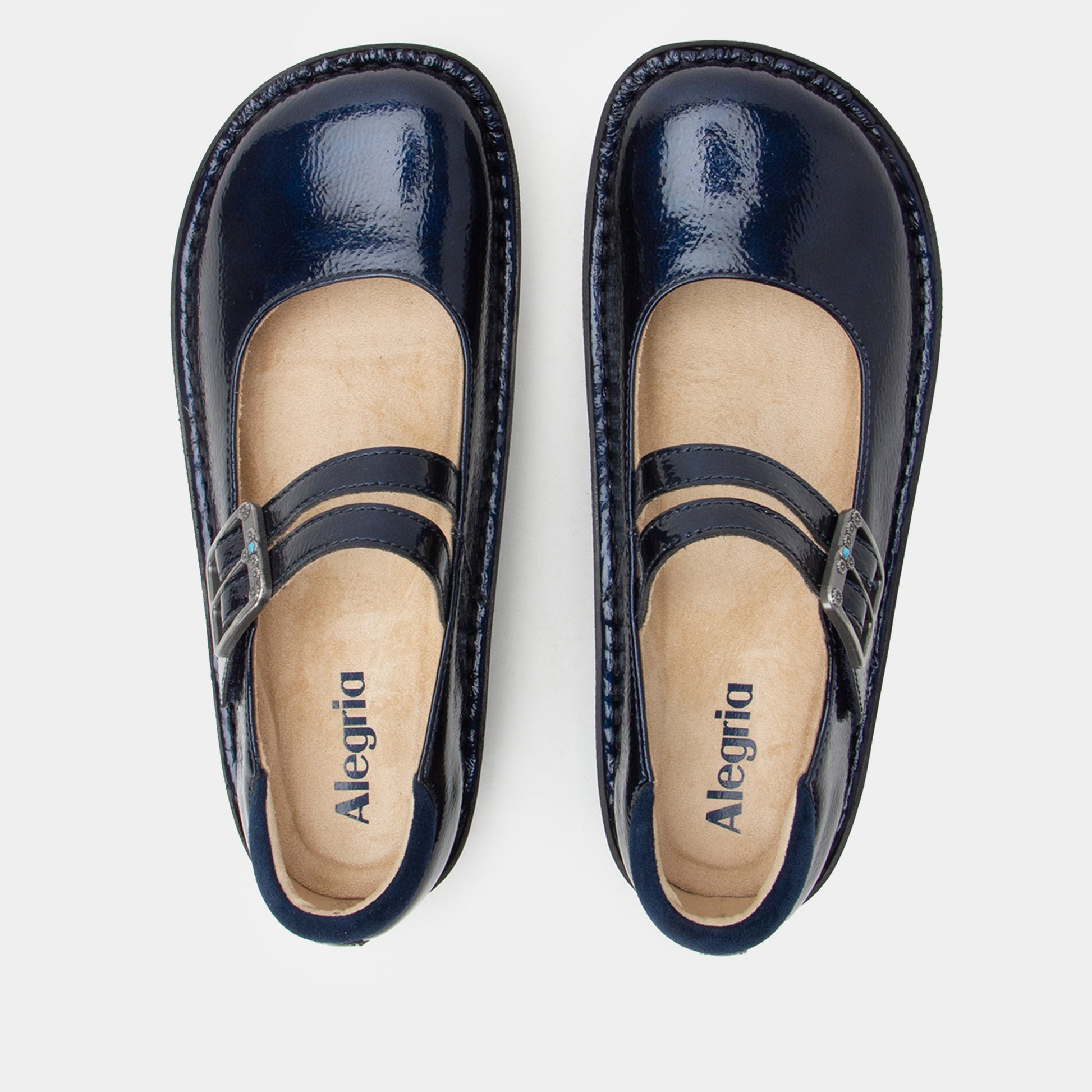 Pair of navy blue shoes with 'Alegria' branding on a light gray background