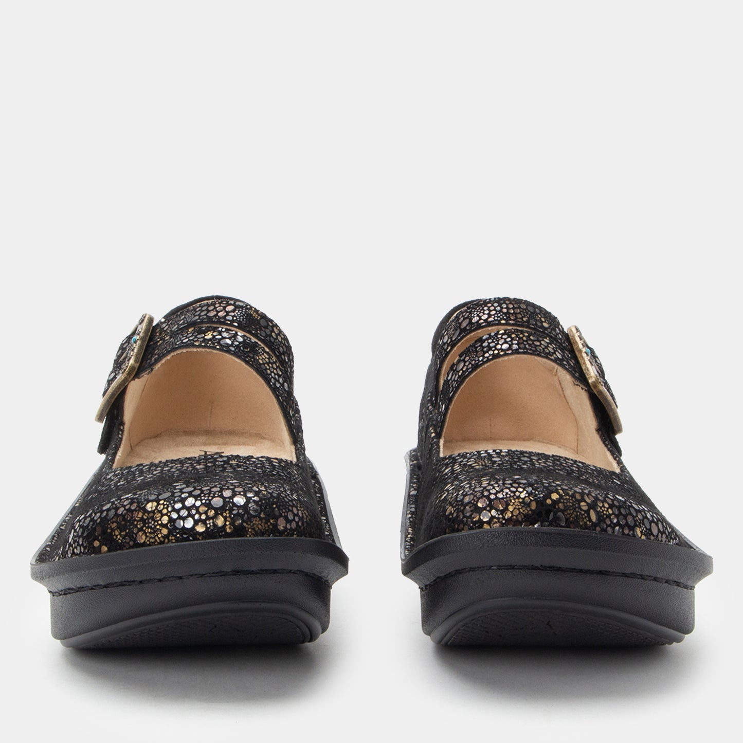 Pair of black glittery shoes on a white background