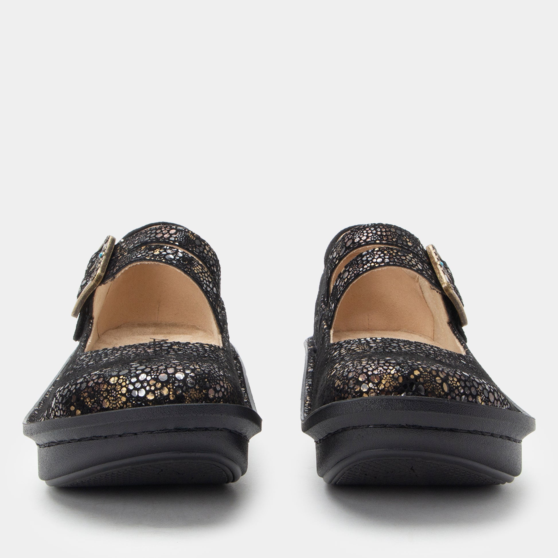 Pair of black glittery shoes on a white background