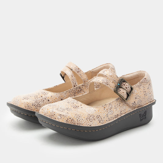 A pair of Mary Jane style platform shoes in beige faux-leather with a speckled pattern, featuring double straps with metal buckles and dark gray platform soles.