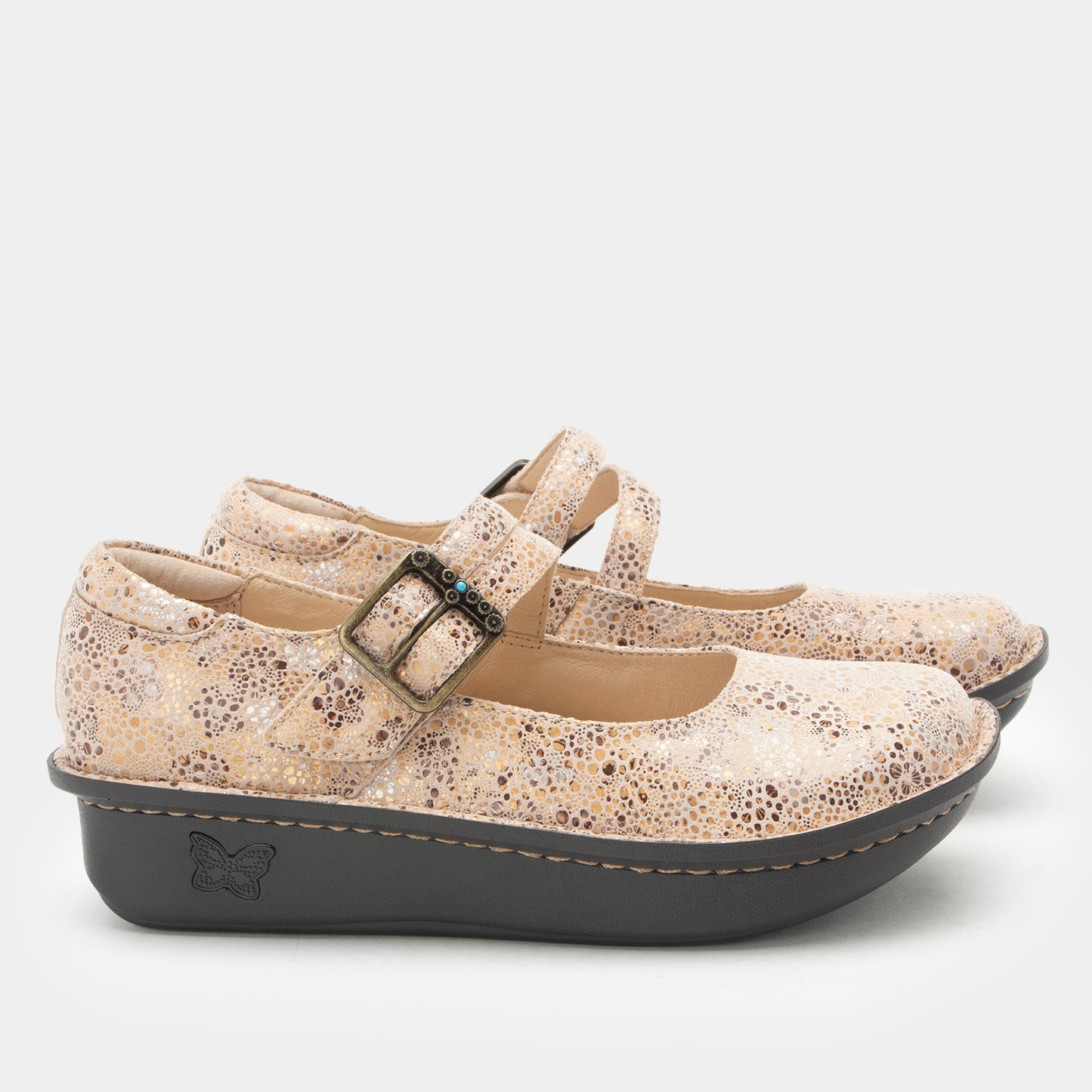 A pair of women's Mary Jane platform shoes with a textured beige and brown speckled upper and a dark gray sole, shown against a light gray background.