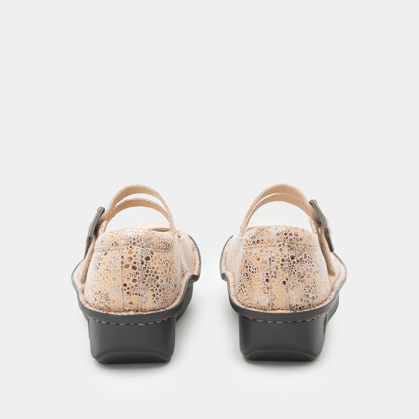 A pair of women's Mary Jane slingback shoes shown from the back, featuring a textured beige and brown reptile-print upper and dark gray wedge heels, set against a plain light gray background.