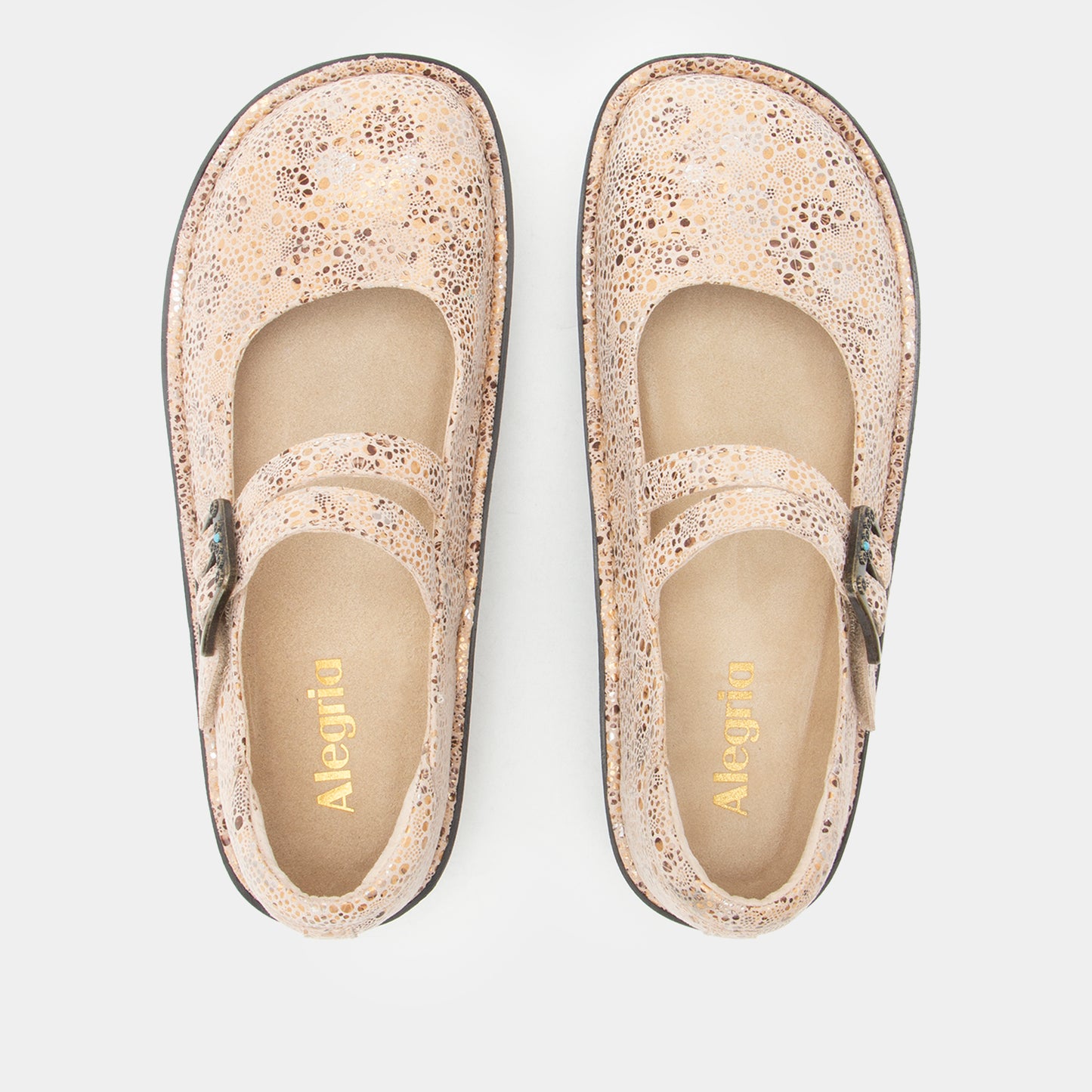 A pair of Alegria Mary Jane style shoes in a textured beige and brown speckled pattern, shown from a top-down view on a light gray background.
