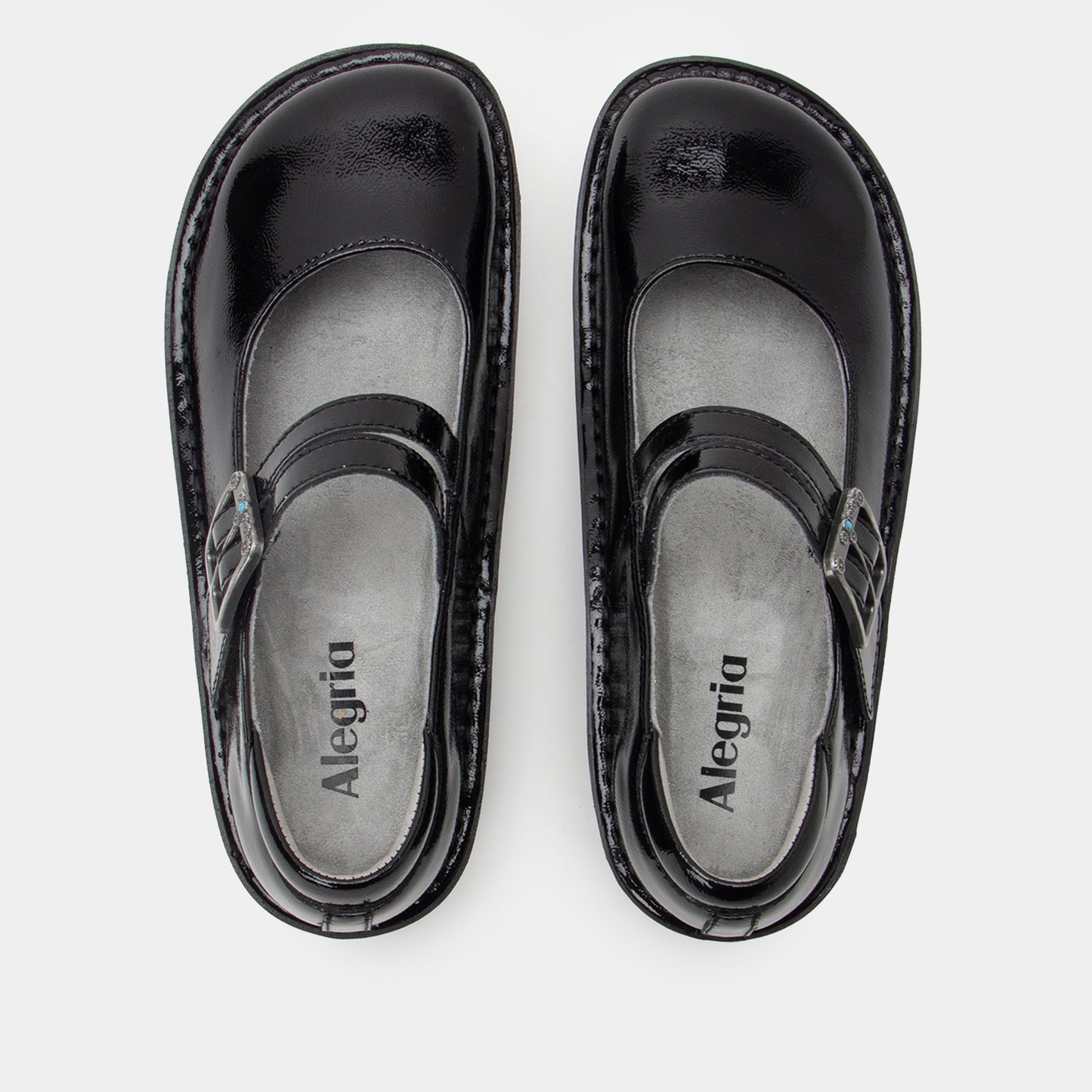 Pair of black sandals with 'Alegria' branding on a white background