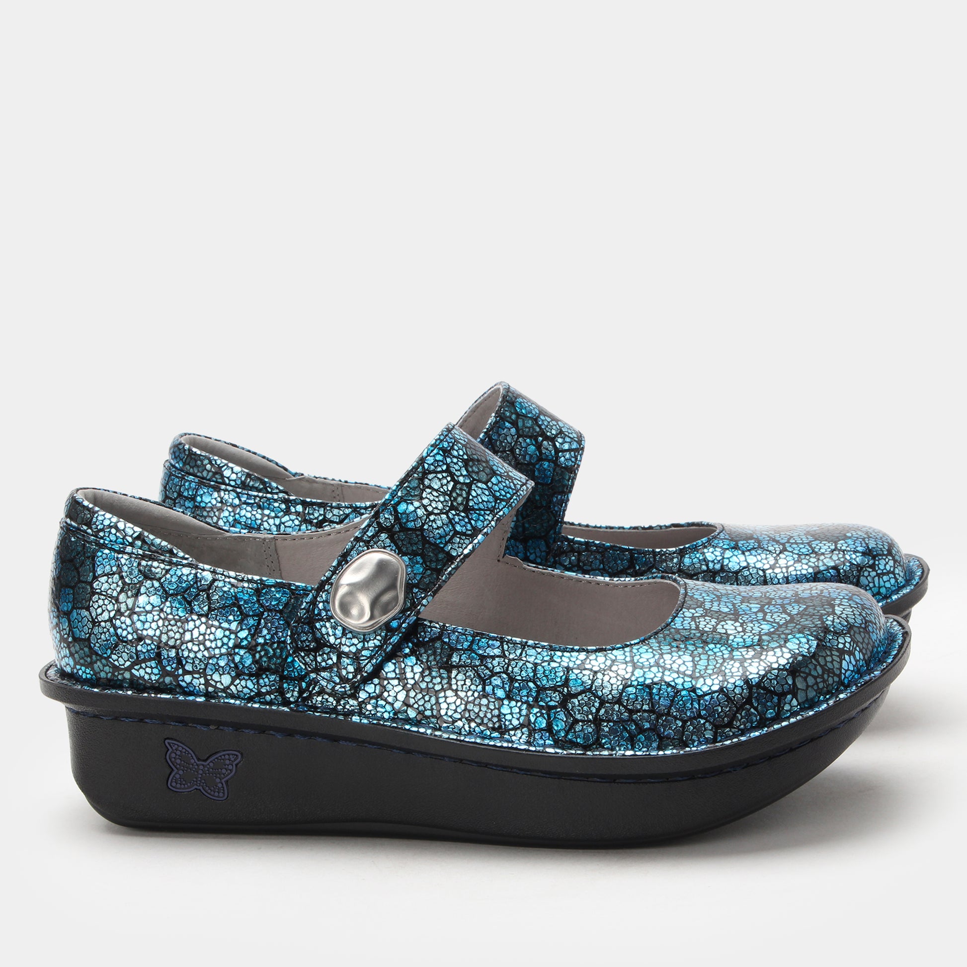 Pair of blue floral-patterned shoes with a strap on a white background