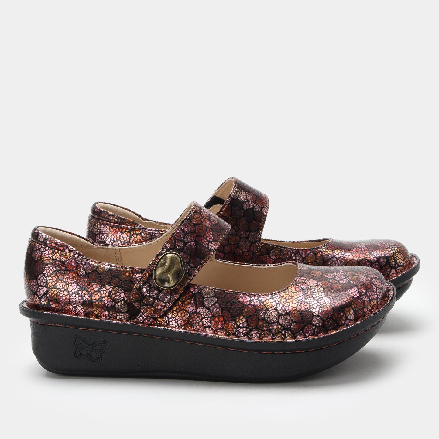 Pair of children's shoes with floral pattern on a white background