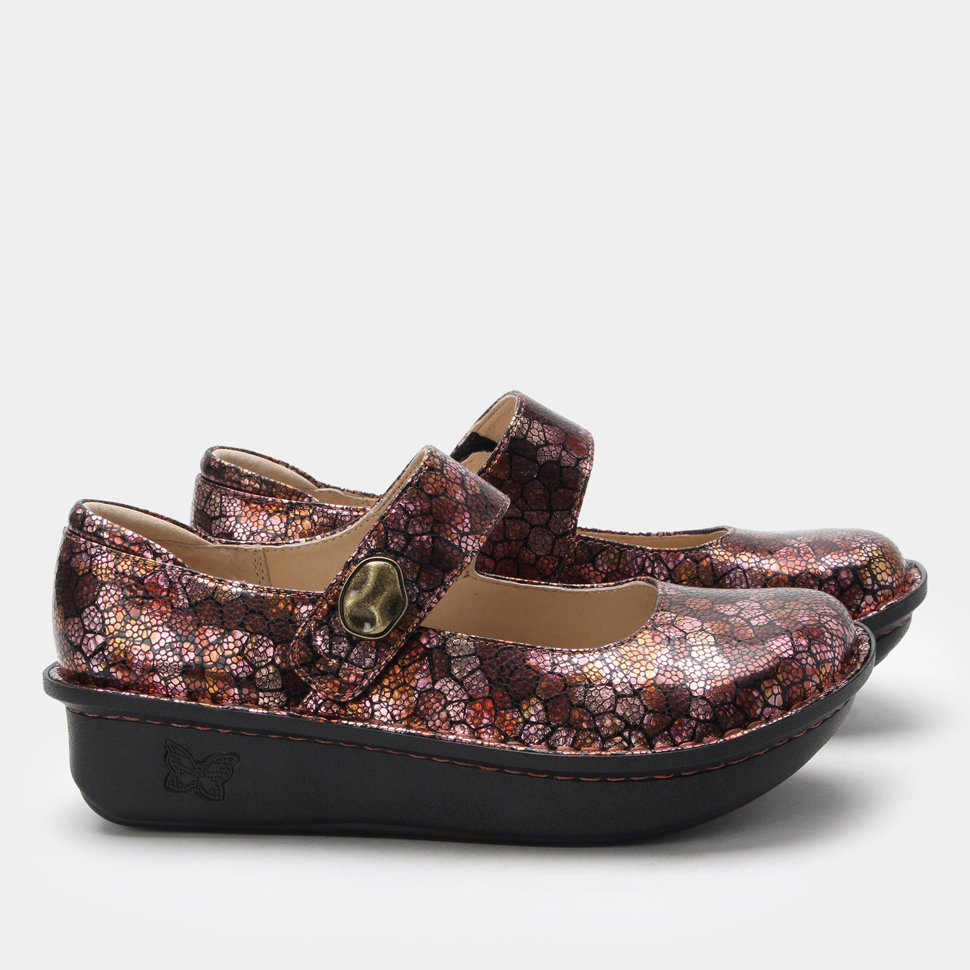 Pair of children's shoes with floral pattern on a white background