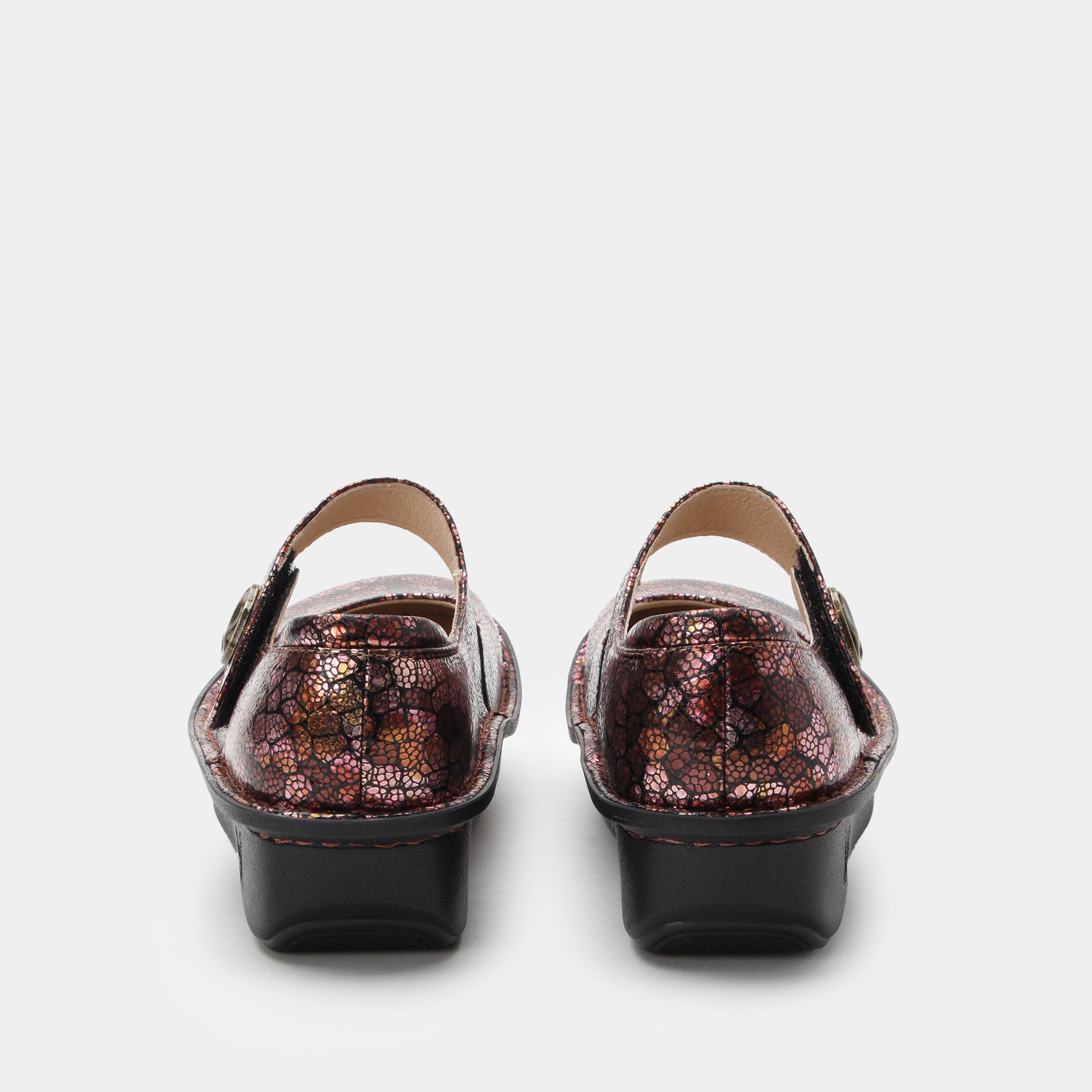 Pair of metallic sandals on a white background