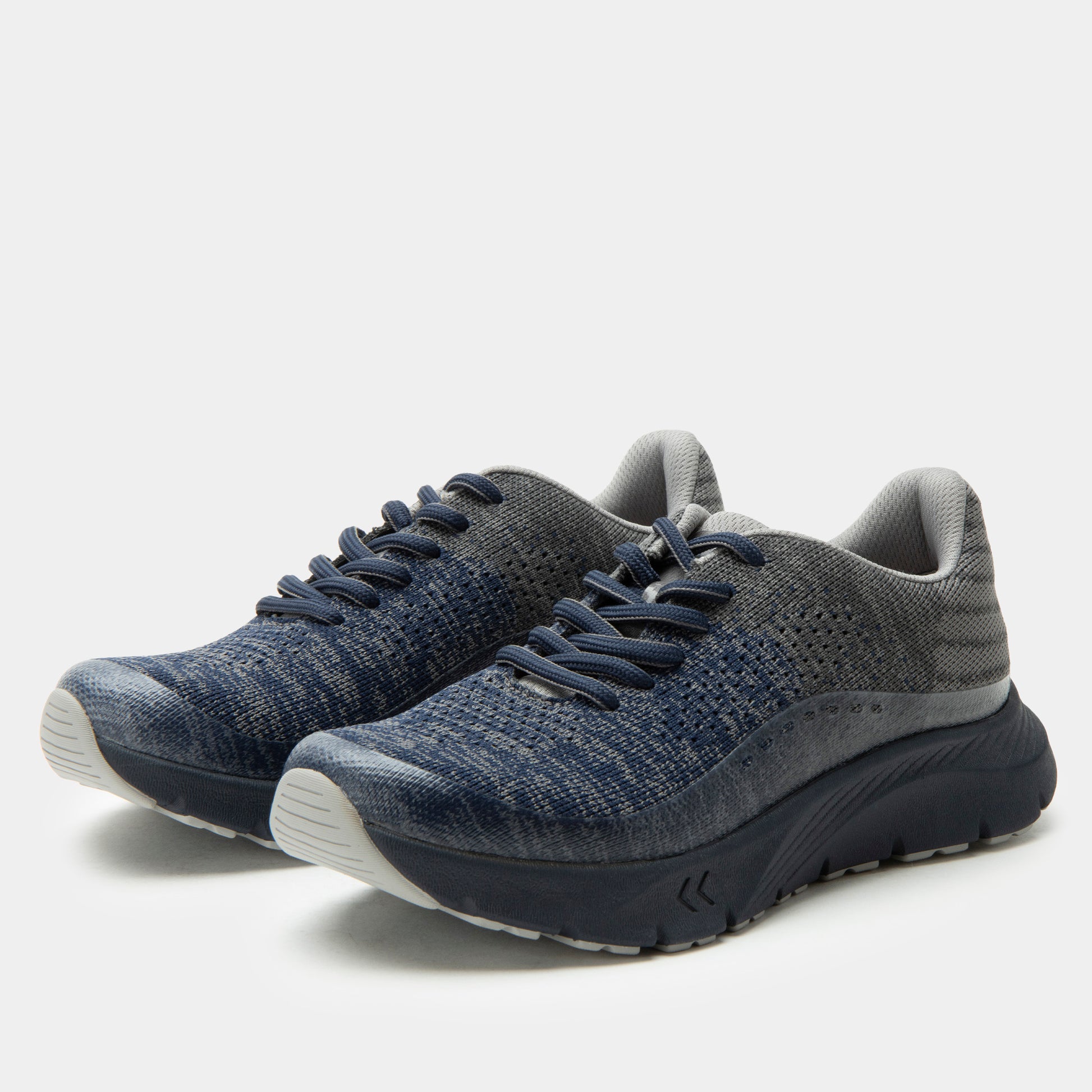 Pair of blue athletic shoes on a white background