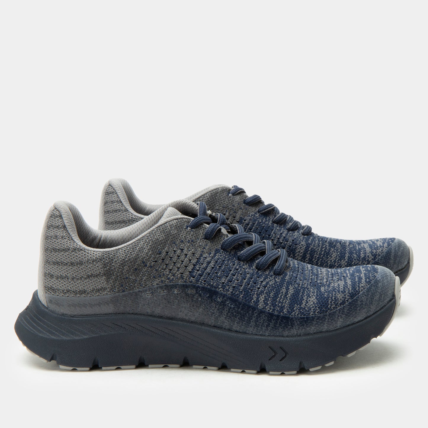 Pair of gray and blue running shoes on a white background