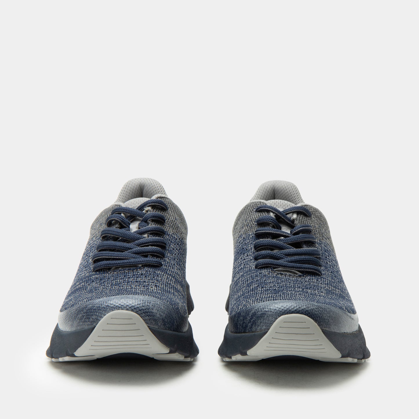 Pair of blue athletic shoes on a white background