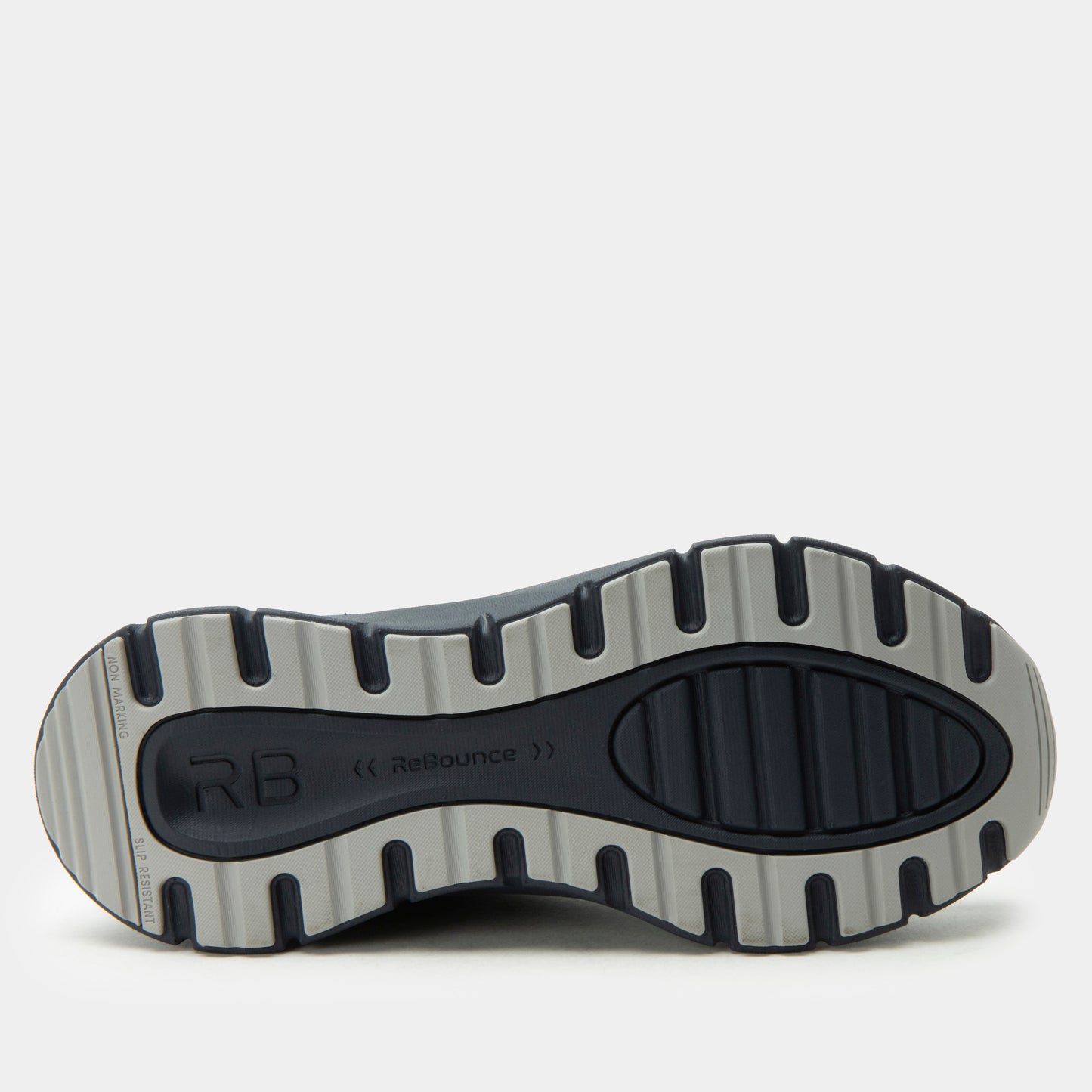 Close-up of a shoe sole with 'RB' branding on a white background