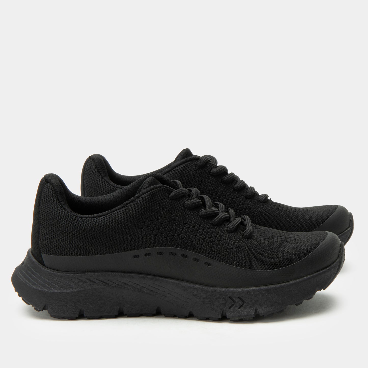 Black running shoes on a light gray background