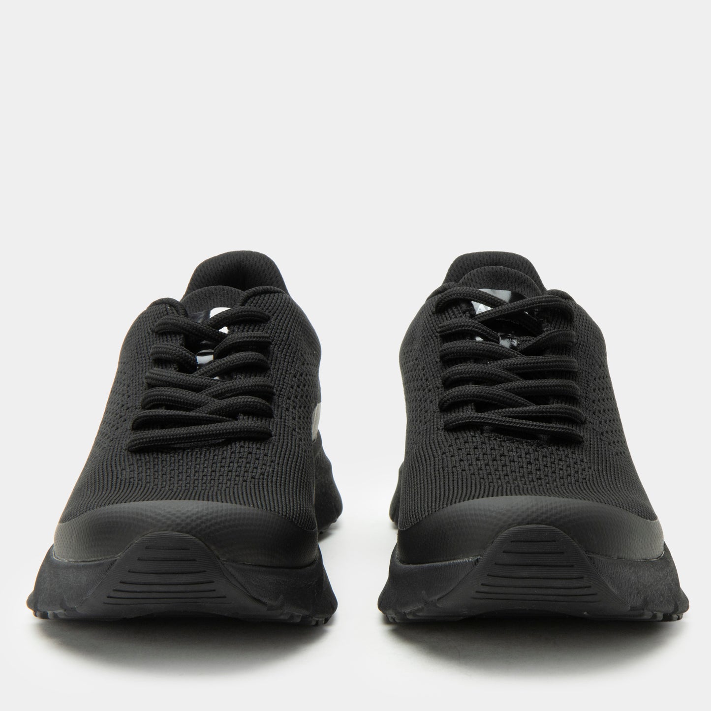 Black athletic shoes on a white background