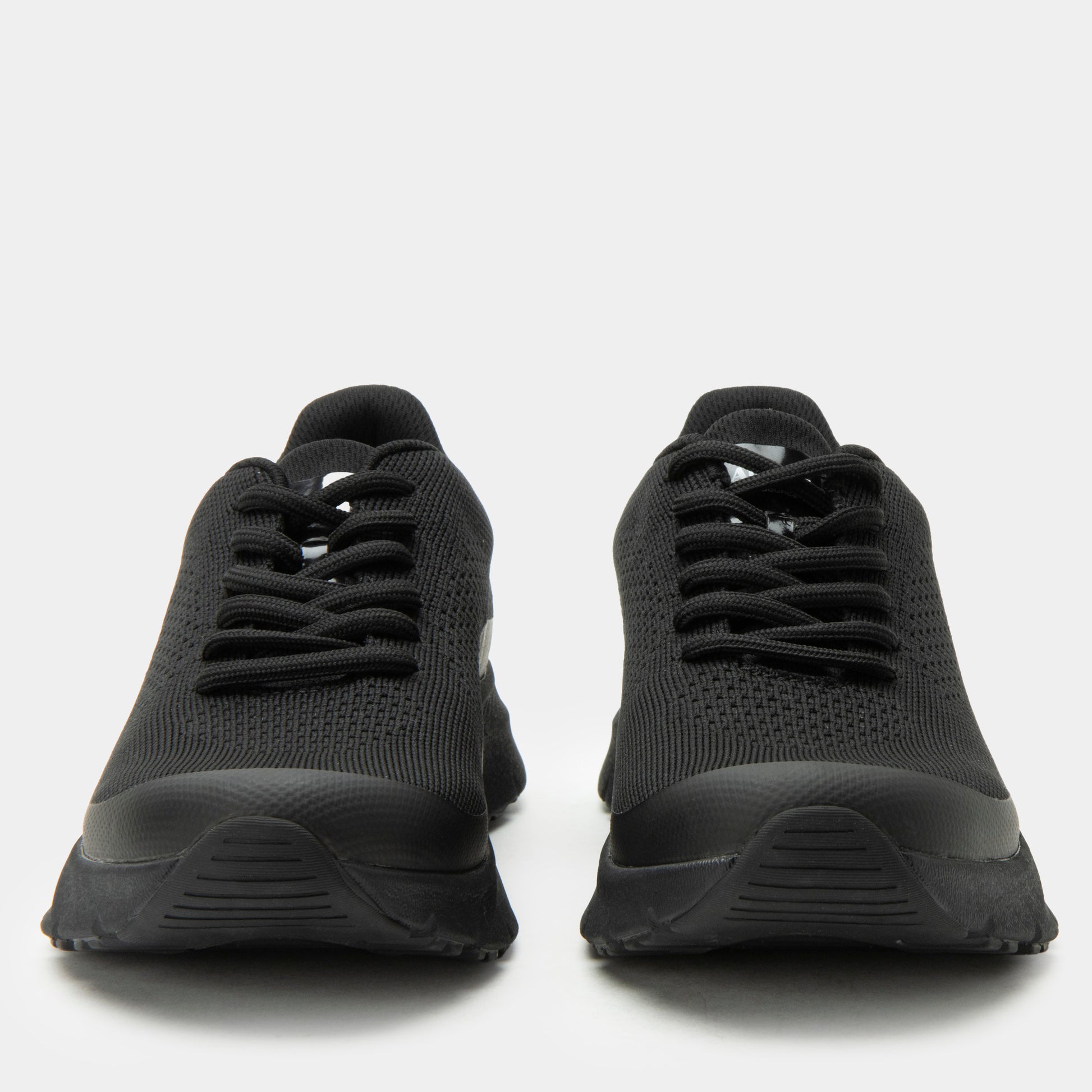 Black athletic shoes on a white background