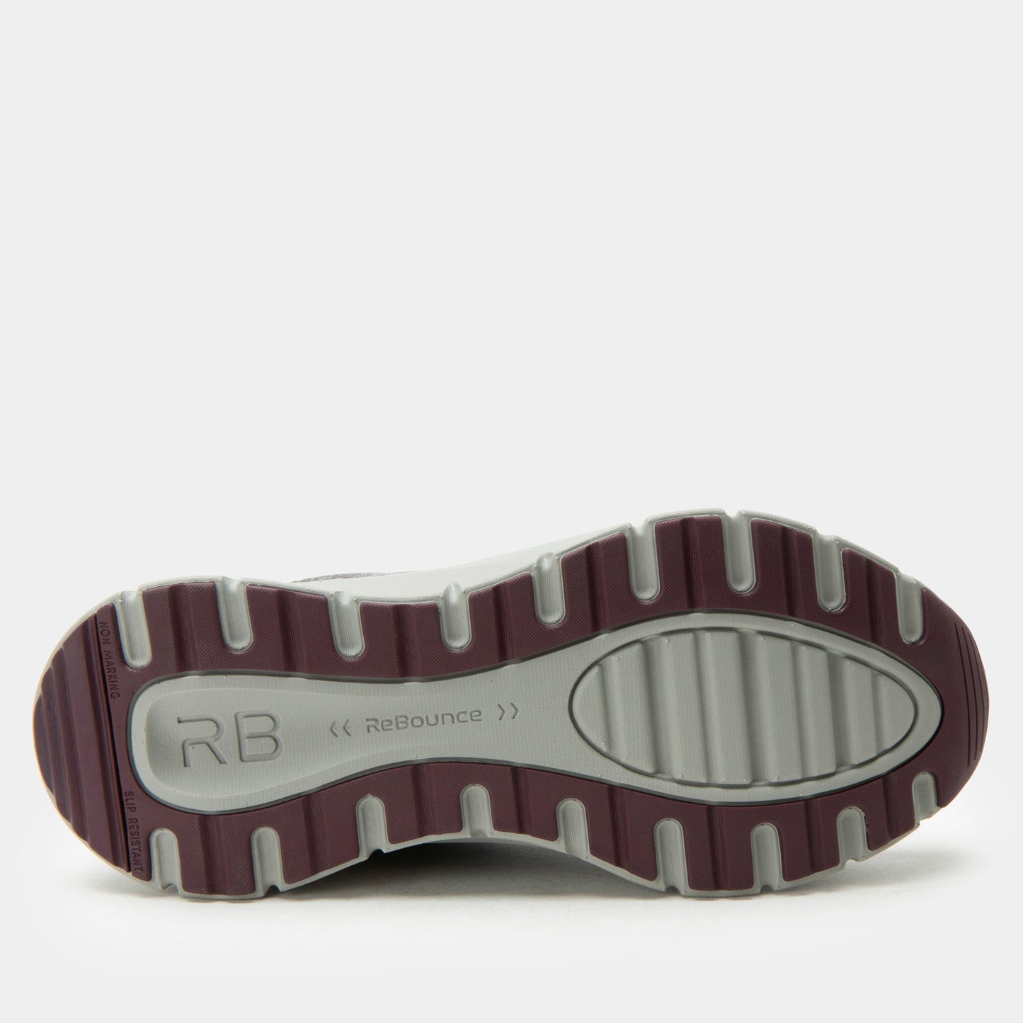 Close-up of a shoe sole with 'RB' branding on a white background
