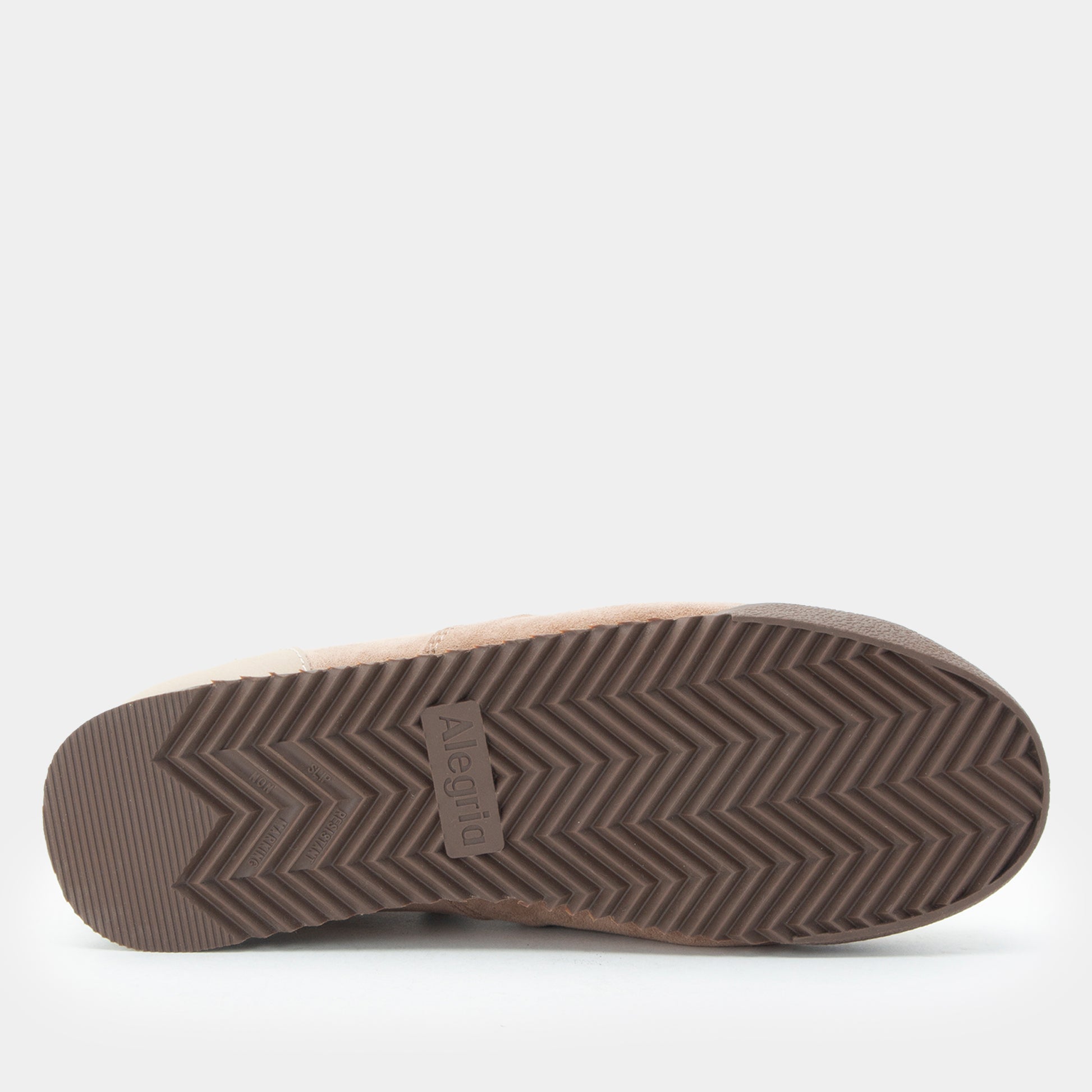 Brown sandal with textured sole on a white background