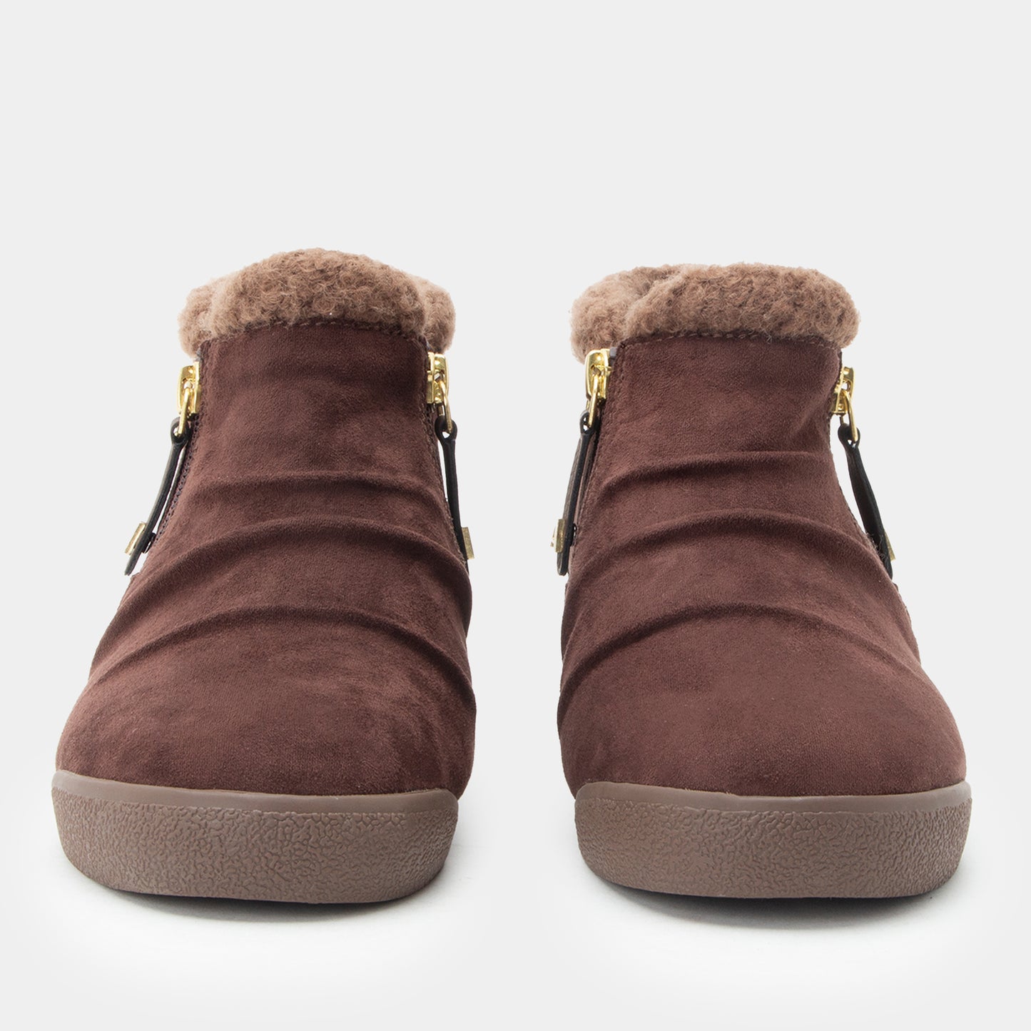 A pair of women's brown suede ankle boots with plush faux-fur trim at the collar, side zippers with black leather tabs, and thick textured soles, shown against a light gray background.