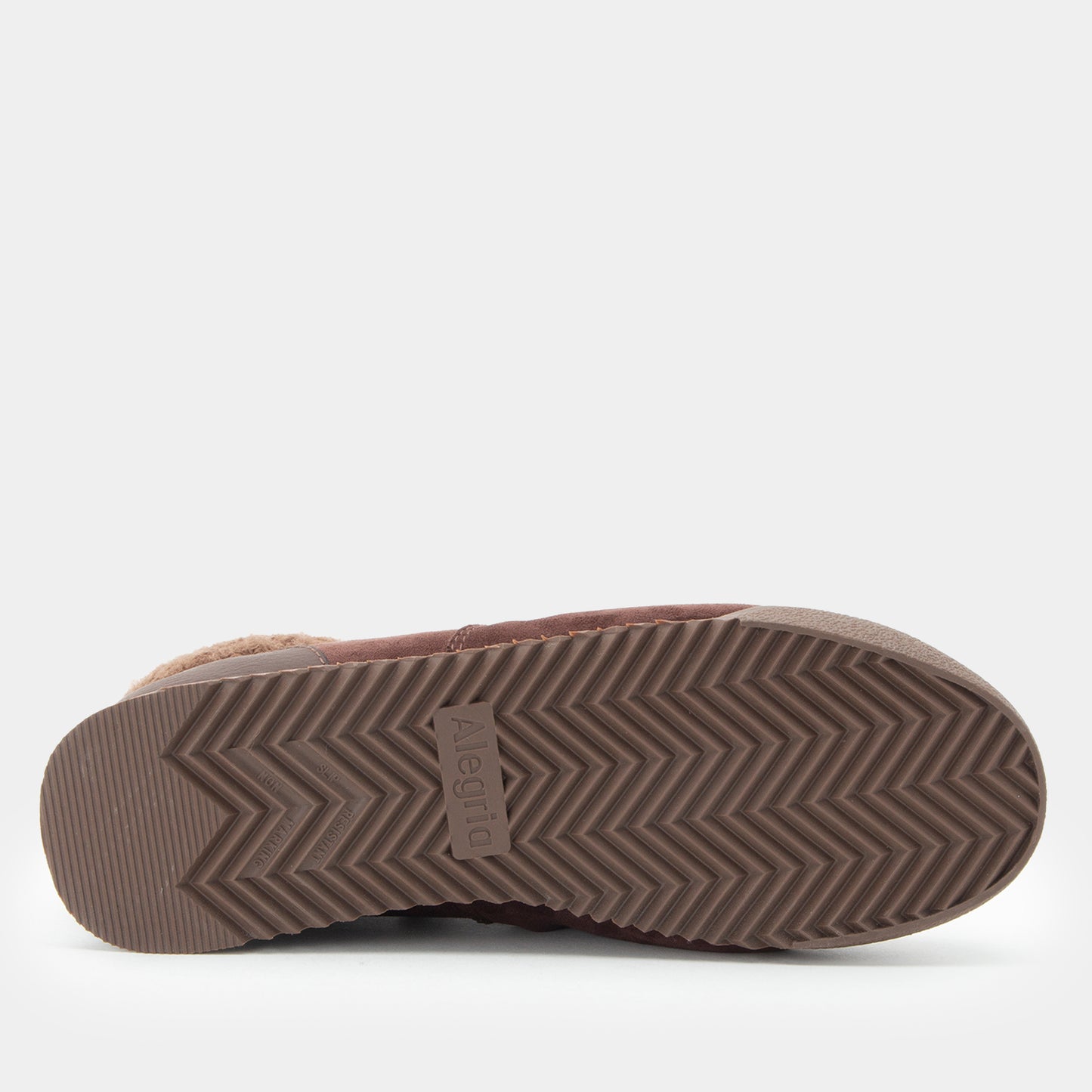 A close-up, top-down view of a shoe's sole, showing a textured brown herringbone-patterned rubber outsole with a small embossed 'Alegria' brand logo in the center.