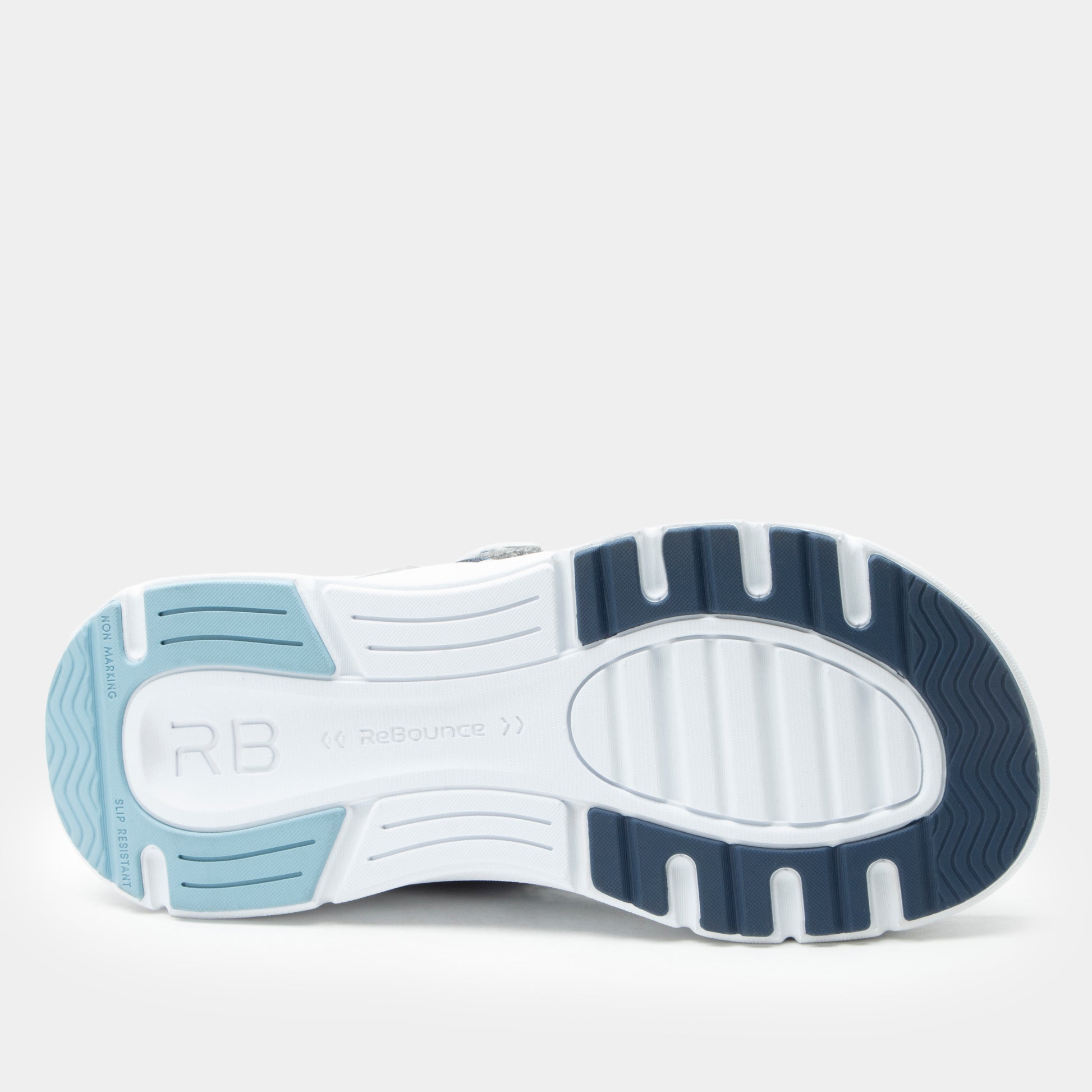 White athletic shoe with blue sole on a light gray background