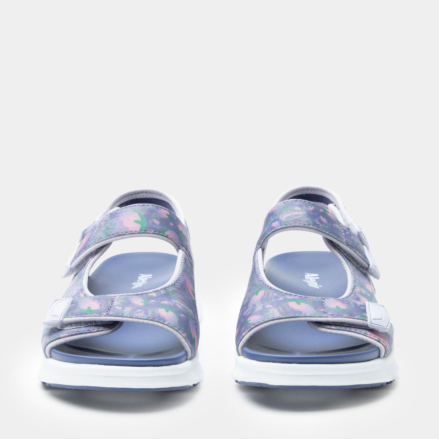 Pair of floral-patterned sandals on a light gray background