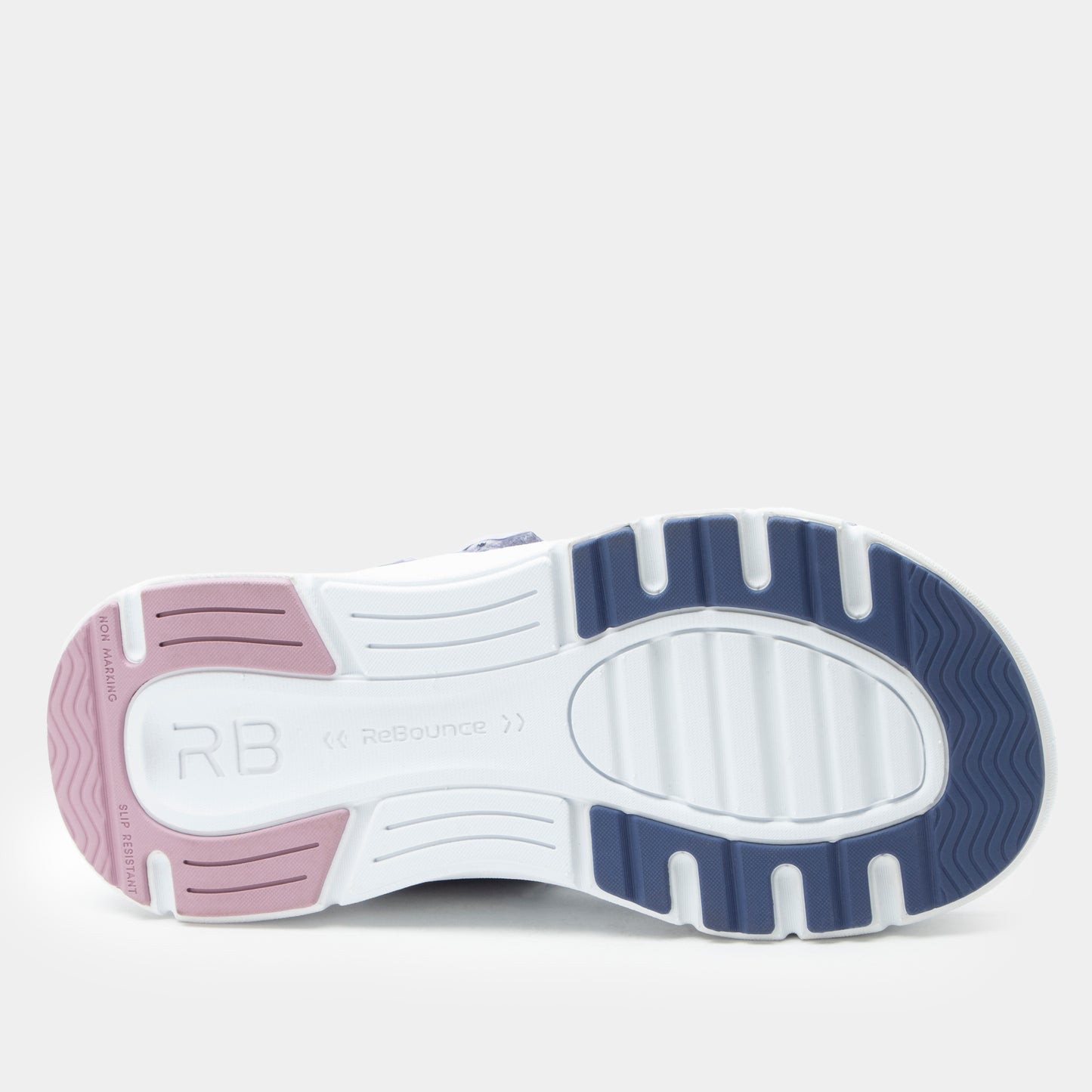 Close-up of a shoe sole with purple and white design on a light gray background