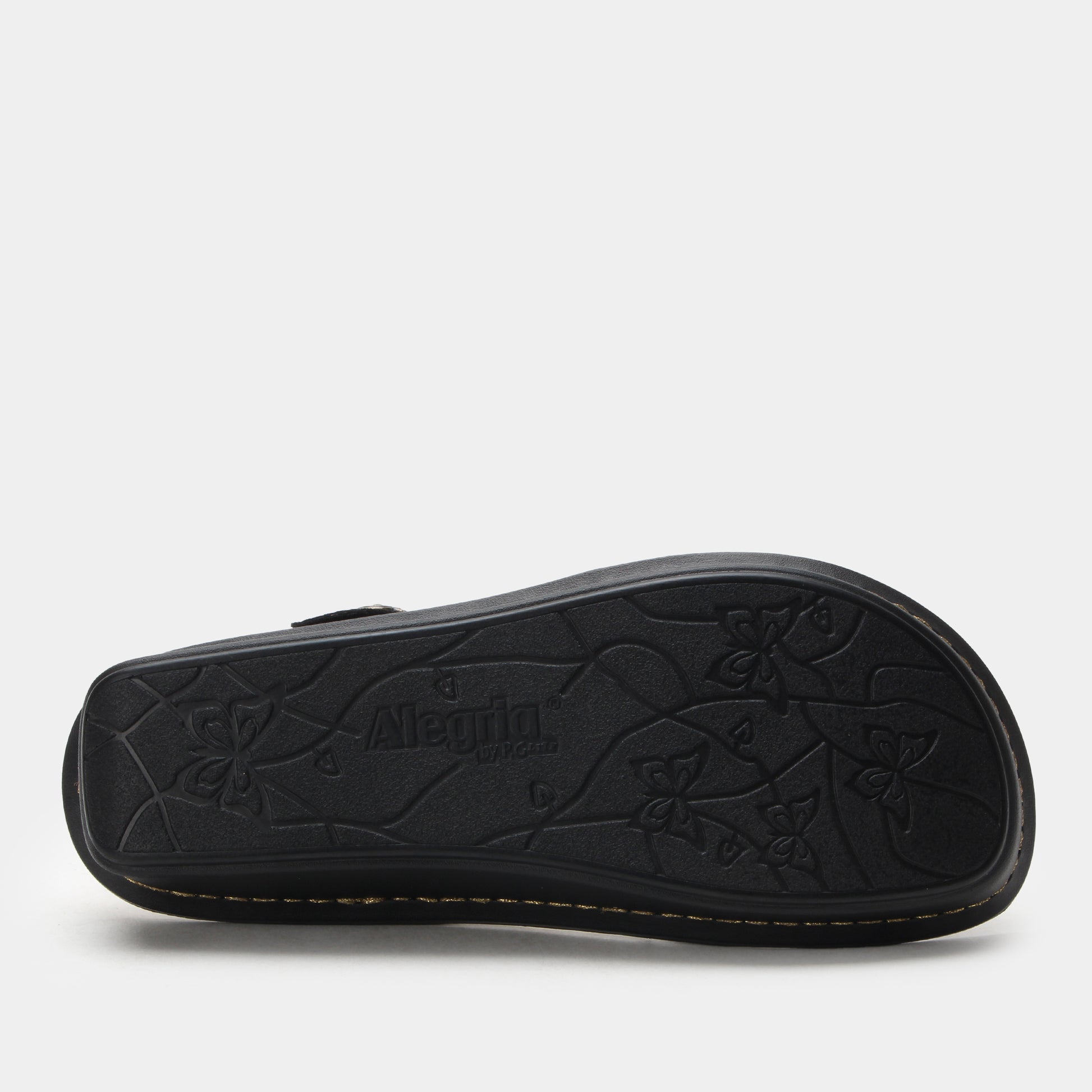 Black sandal with floral pattern on a white background
