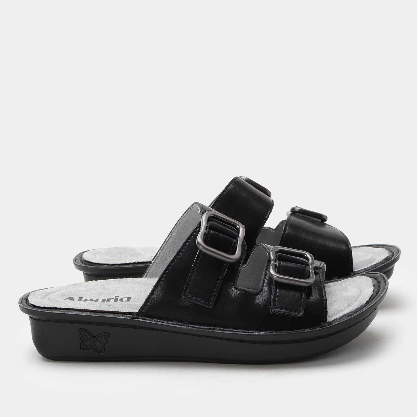 Black sandal with two buckles on a white background