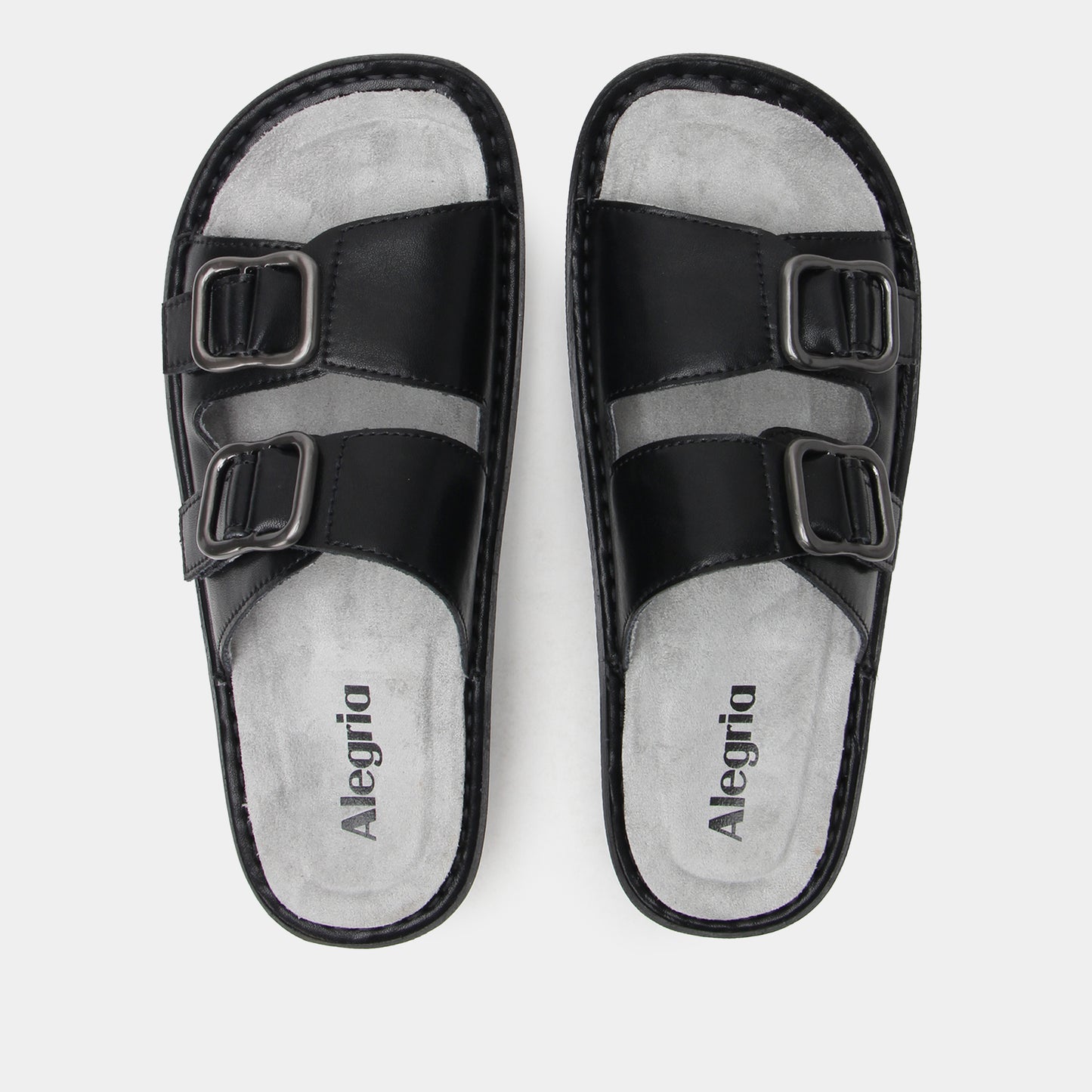 Black sandals with buckle straps on a white background, featuring the brand 'Alegria'.