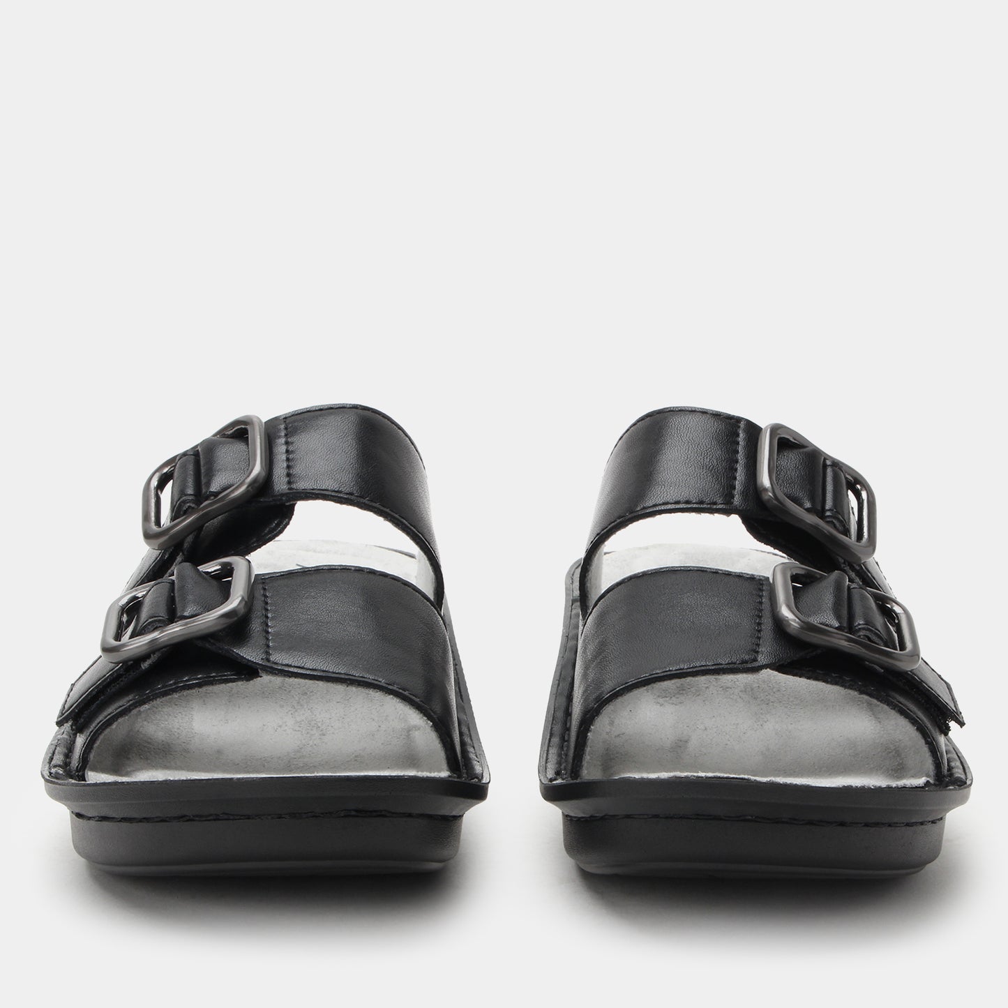 Black sandals with multiple straps on a white background