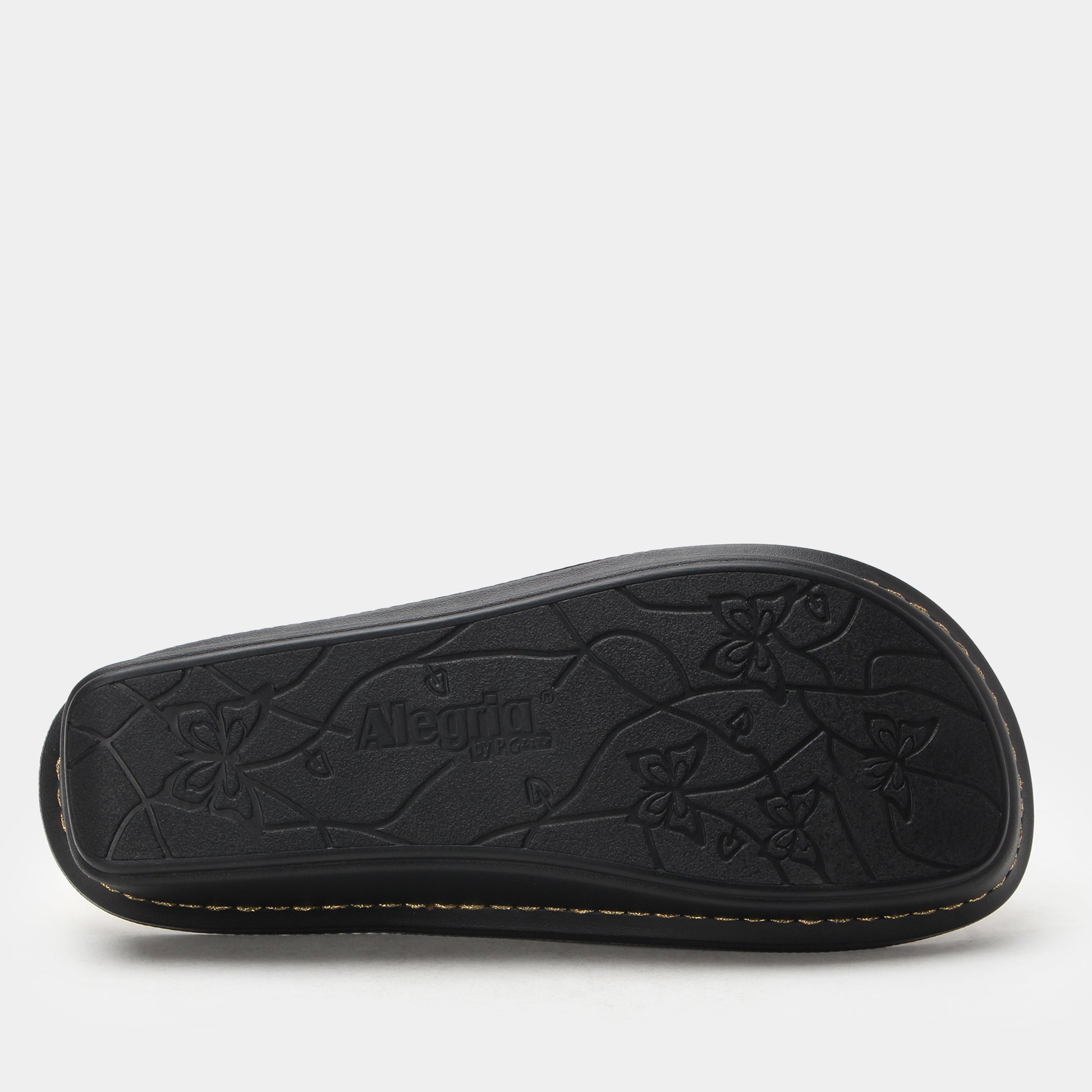 Black sandal sole with floral patterns and 'Alpina' branding on a white background