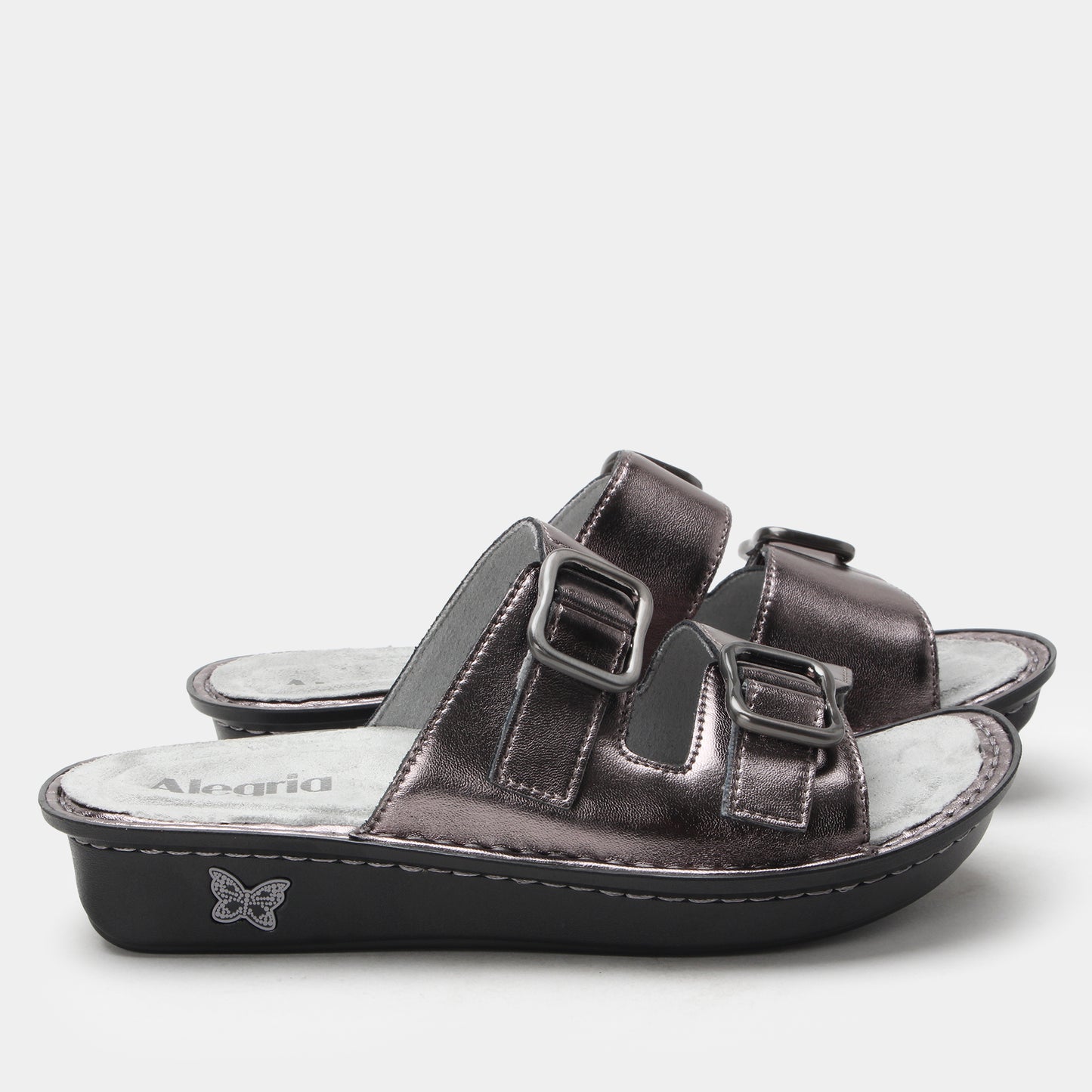 Black sandal with multiple straps on a white background