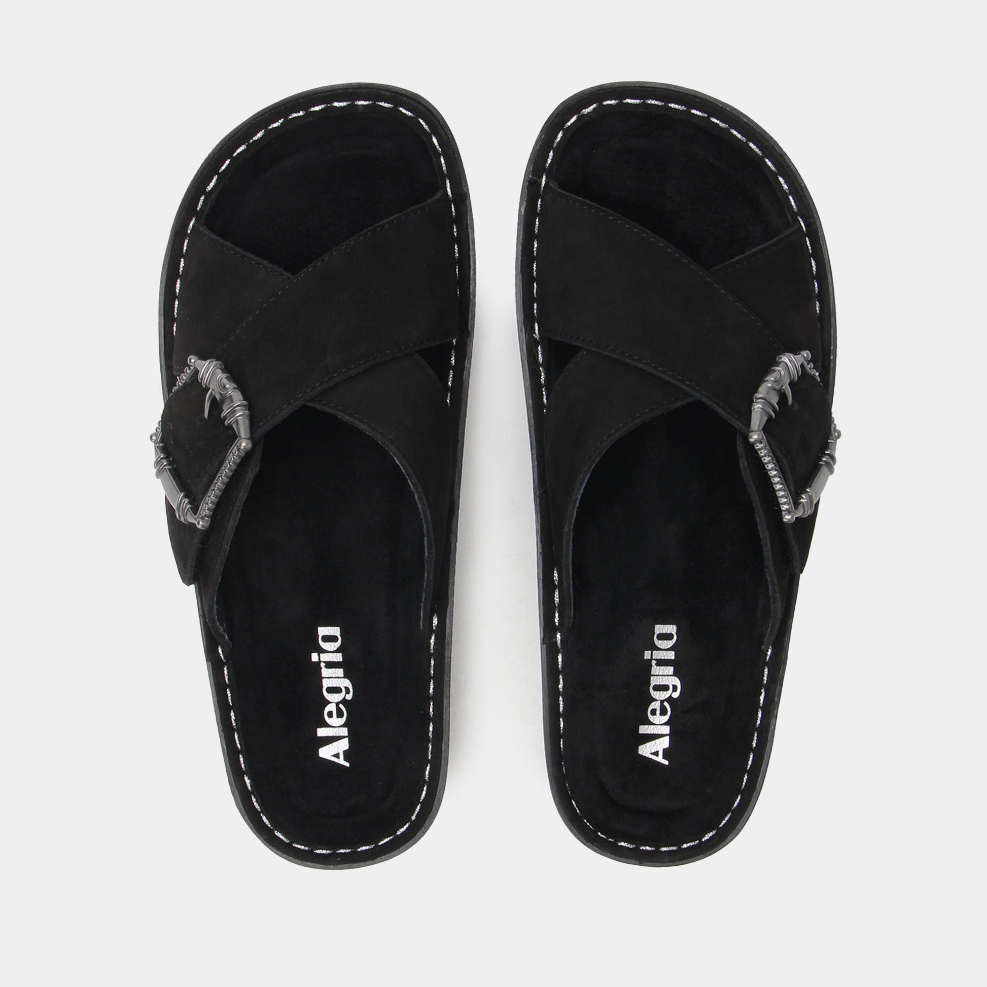 Pair of black sandals with 'Alegria' branding on a light gray background